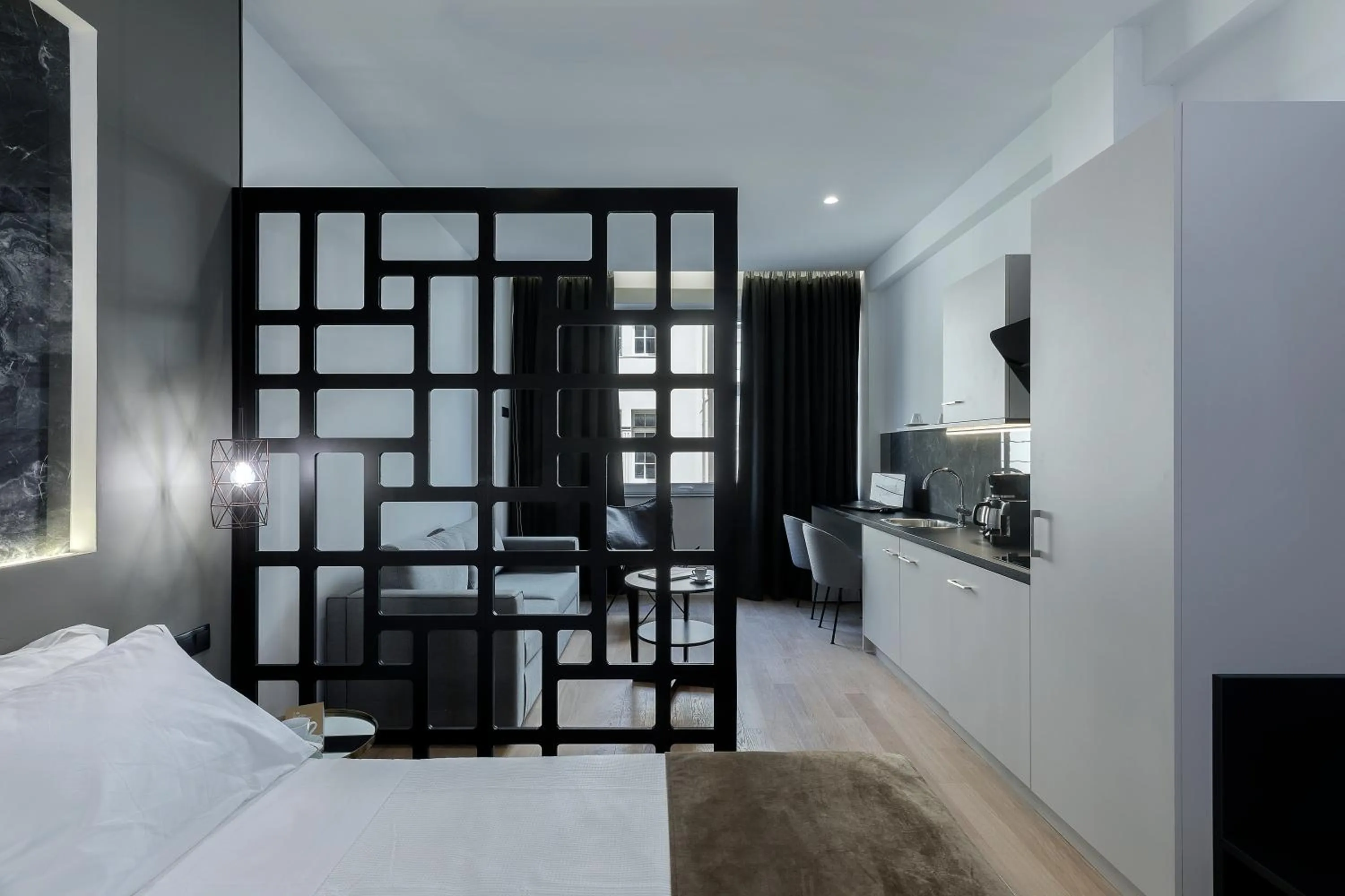 Living room, Bed in Philosofia Athens Suites