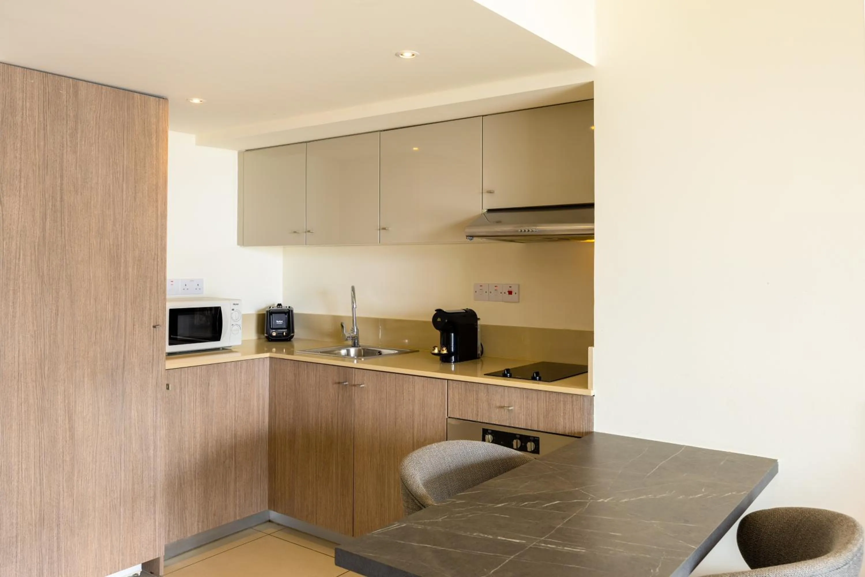 Kitchen or kitchenette in Melpo Antia Hotel & Suites