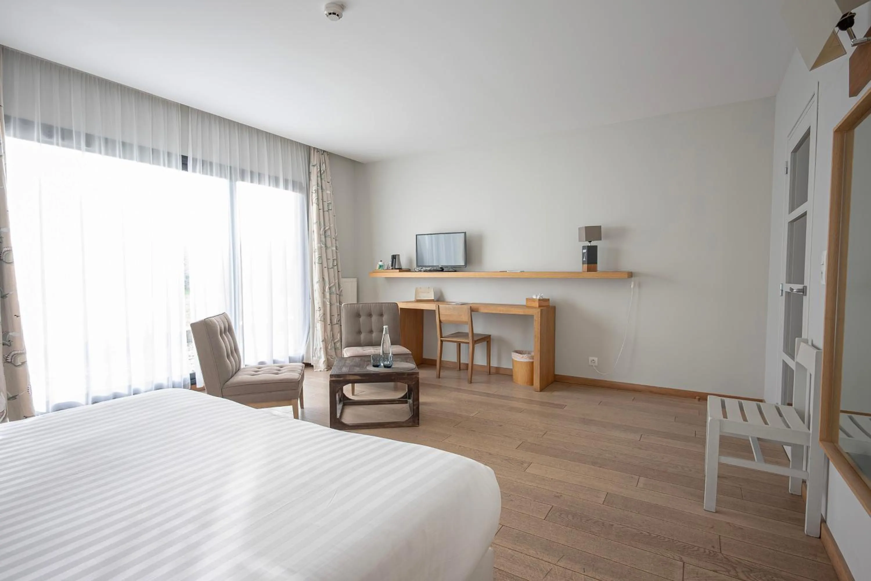 Garden view, Bed in Logis Le Château de Sable