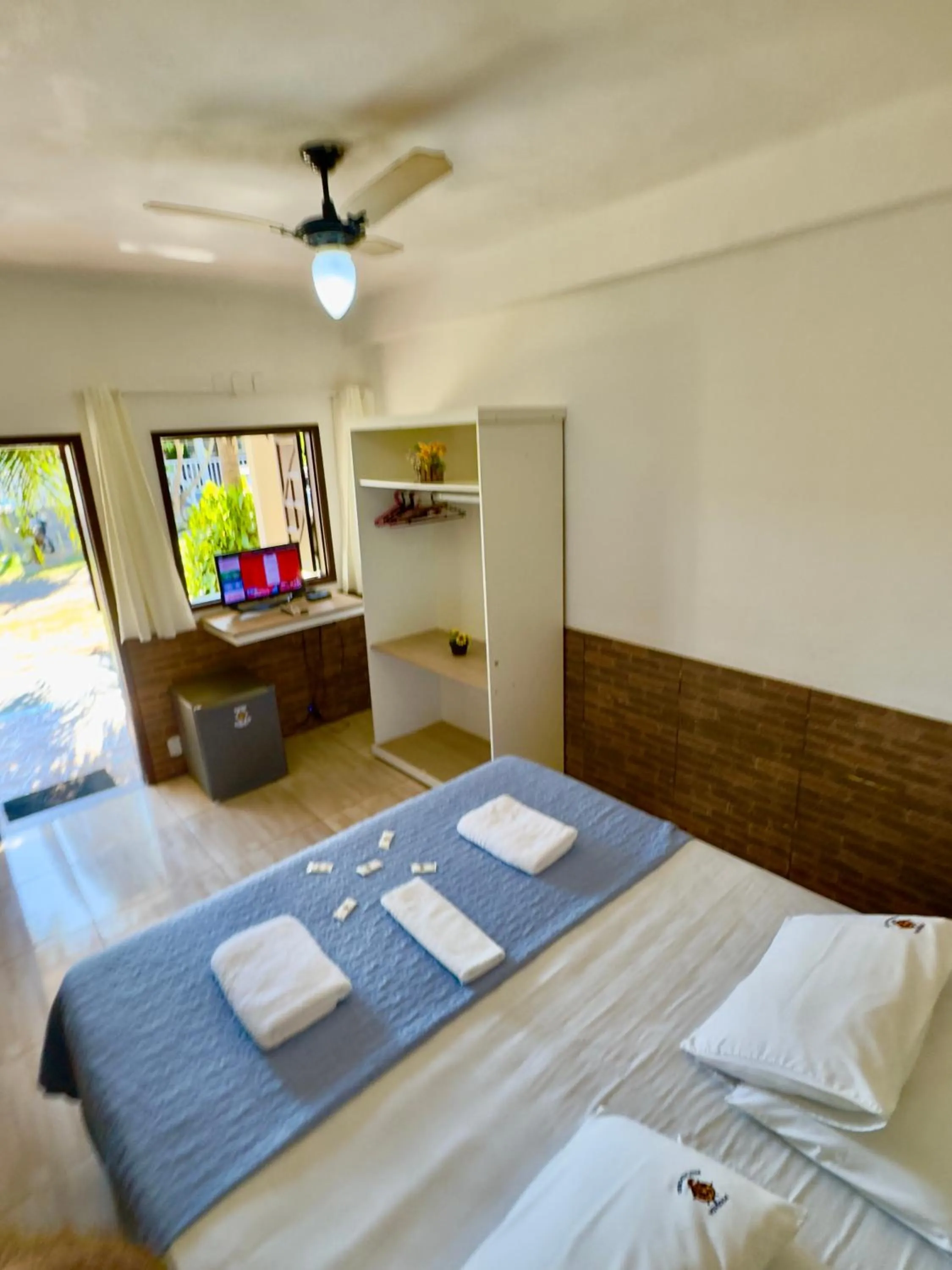 Bed in Pousada Três Pescadores