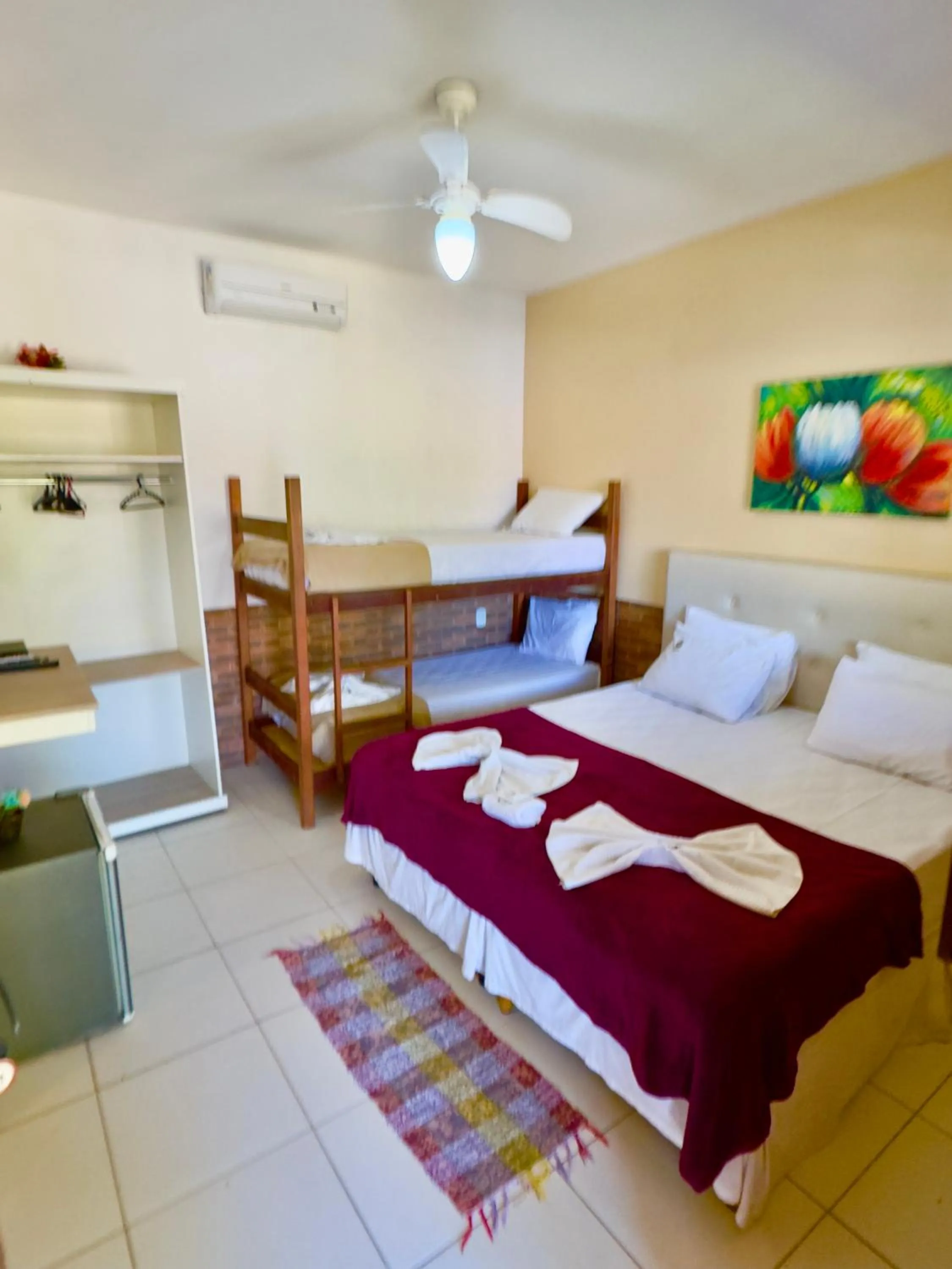 Bed in Pousada Três Pescadores