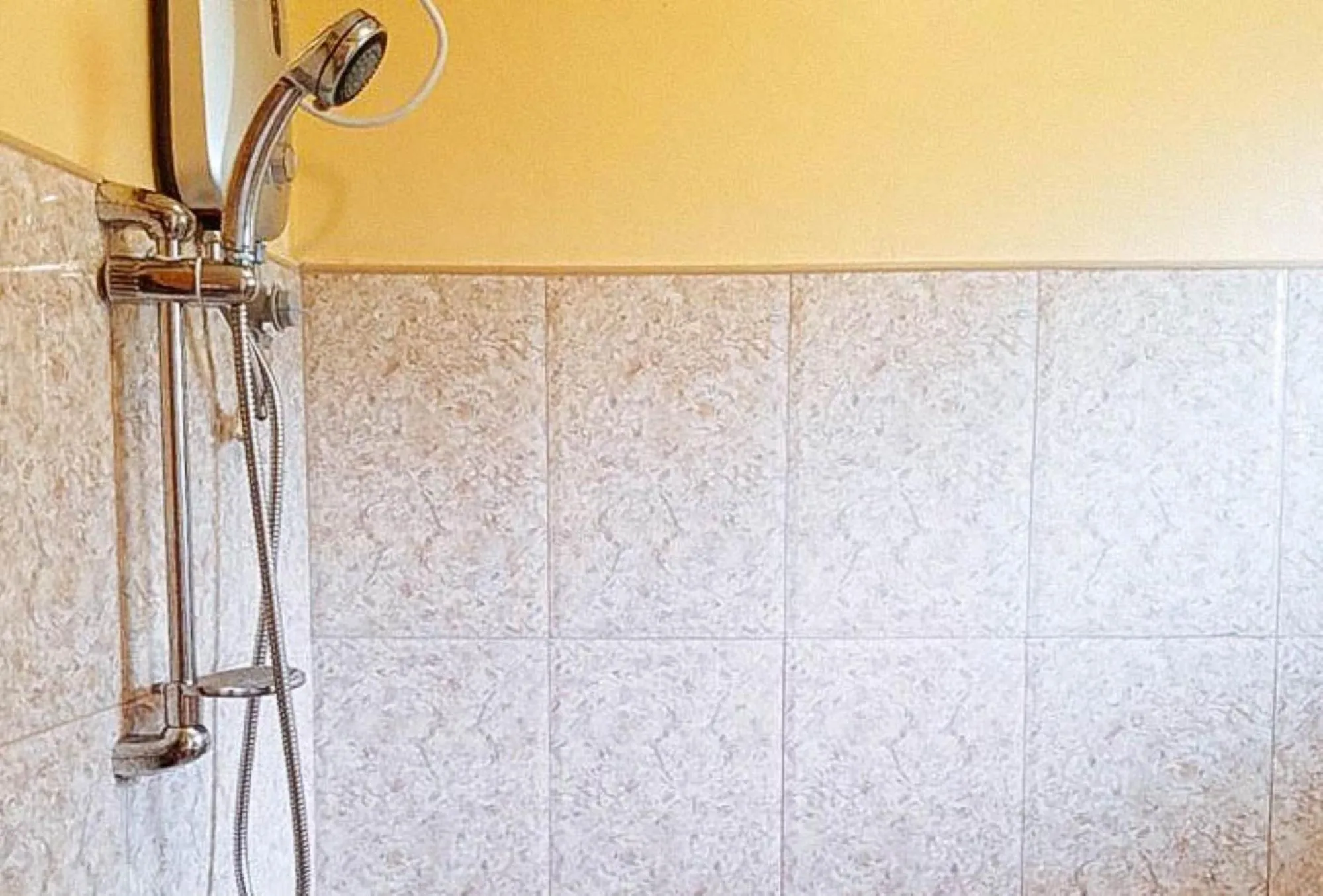 Shower in RedDoorz at Shandy's Transient House Palompon