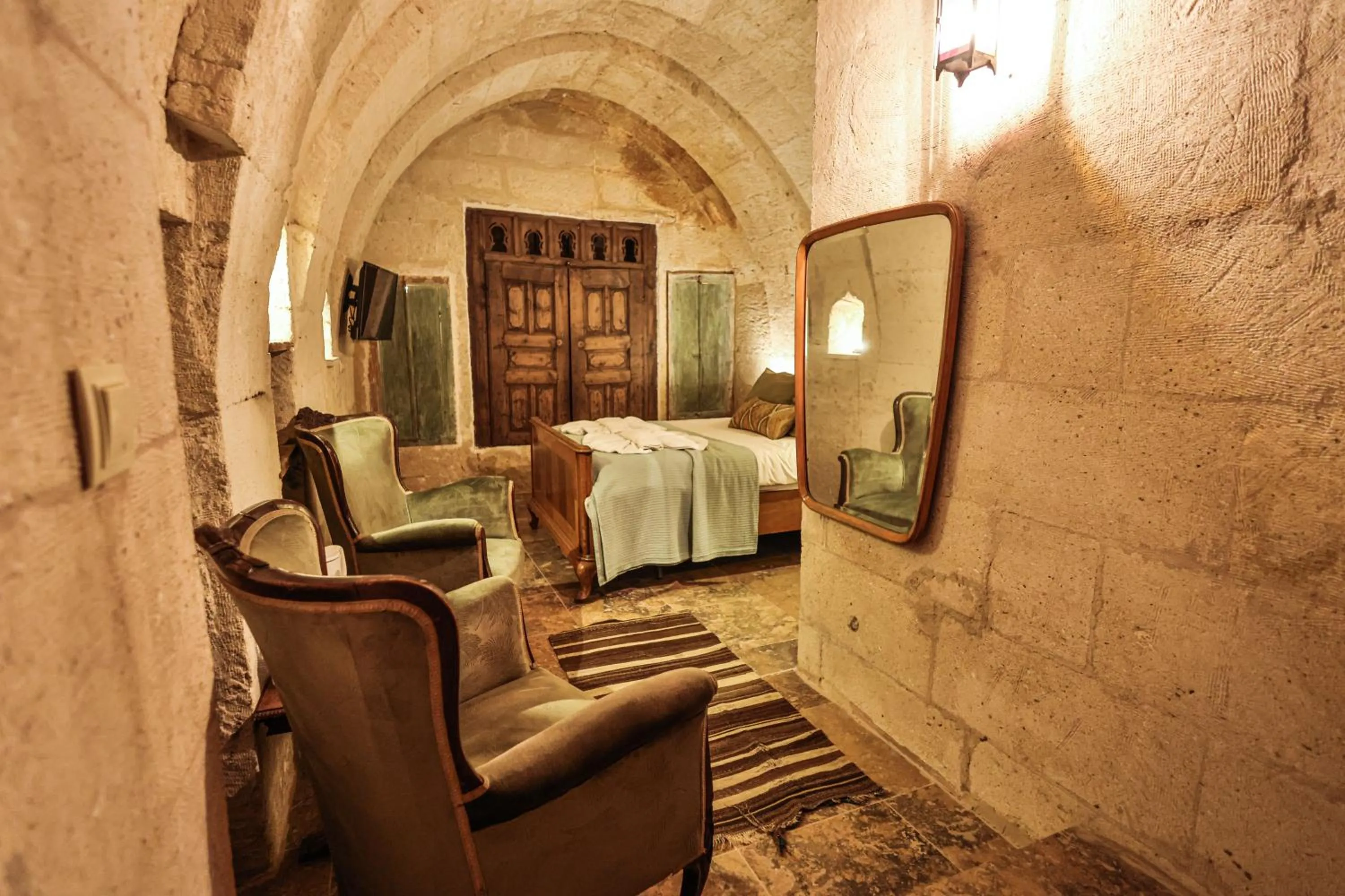 Living room, Bed in Cappadocia Eagle Cave Inn