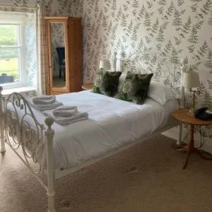 Bed in The Punch Bowl Inn