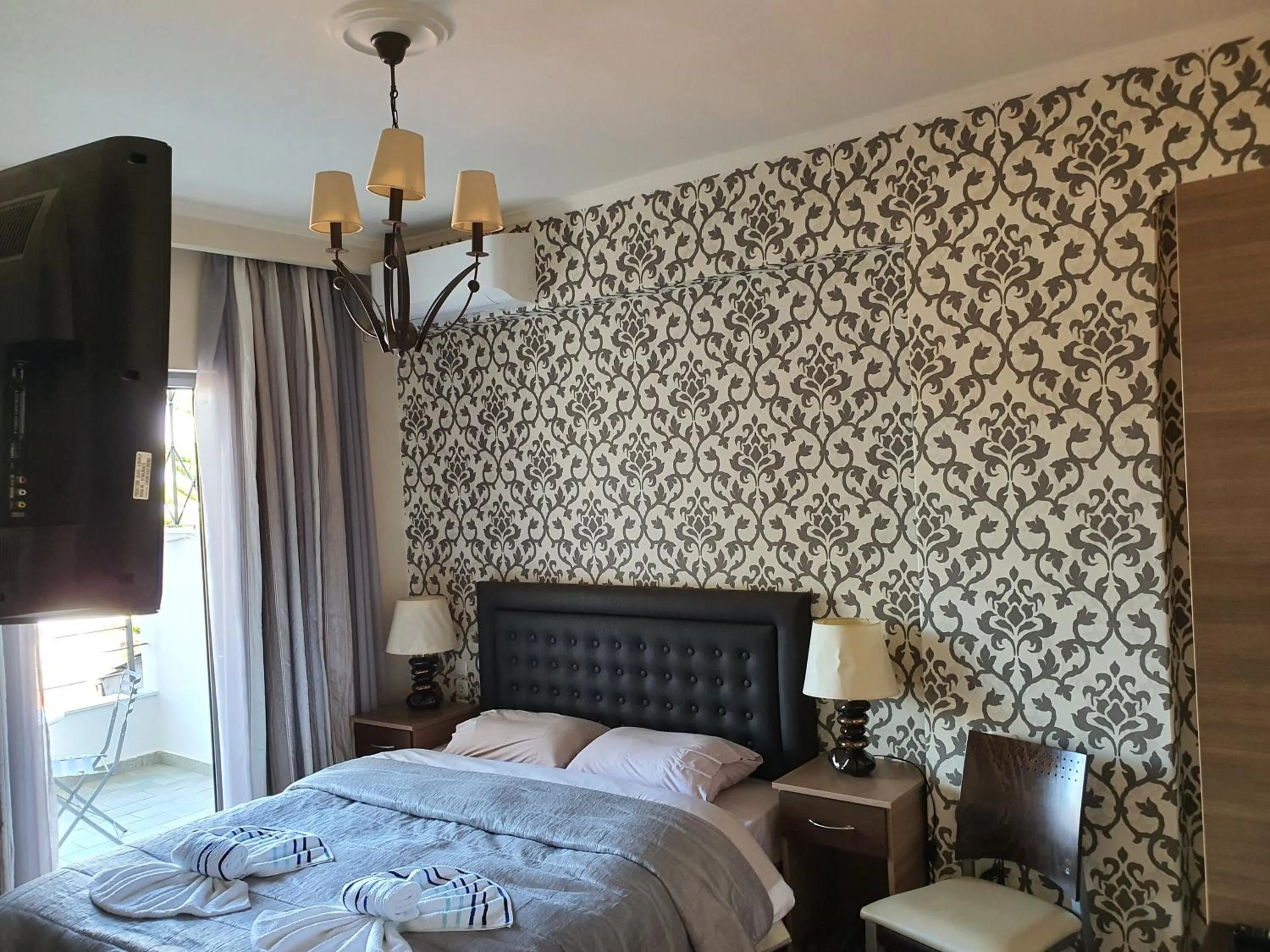 Bed in Delfini Hotel