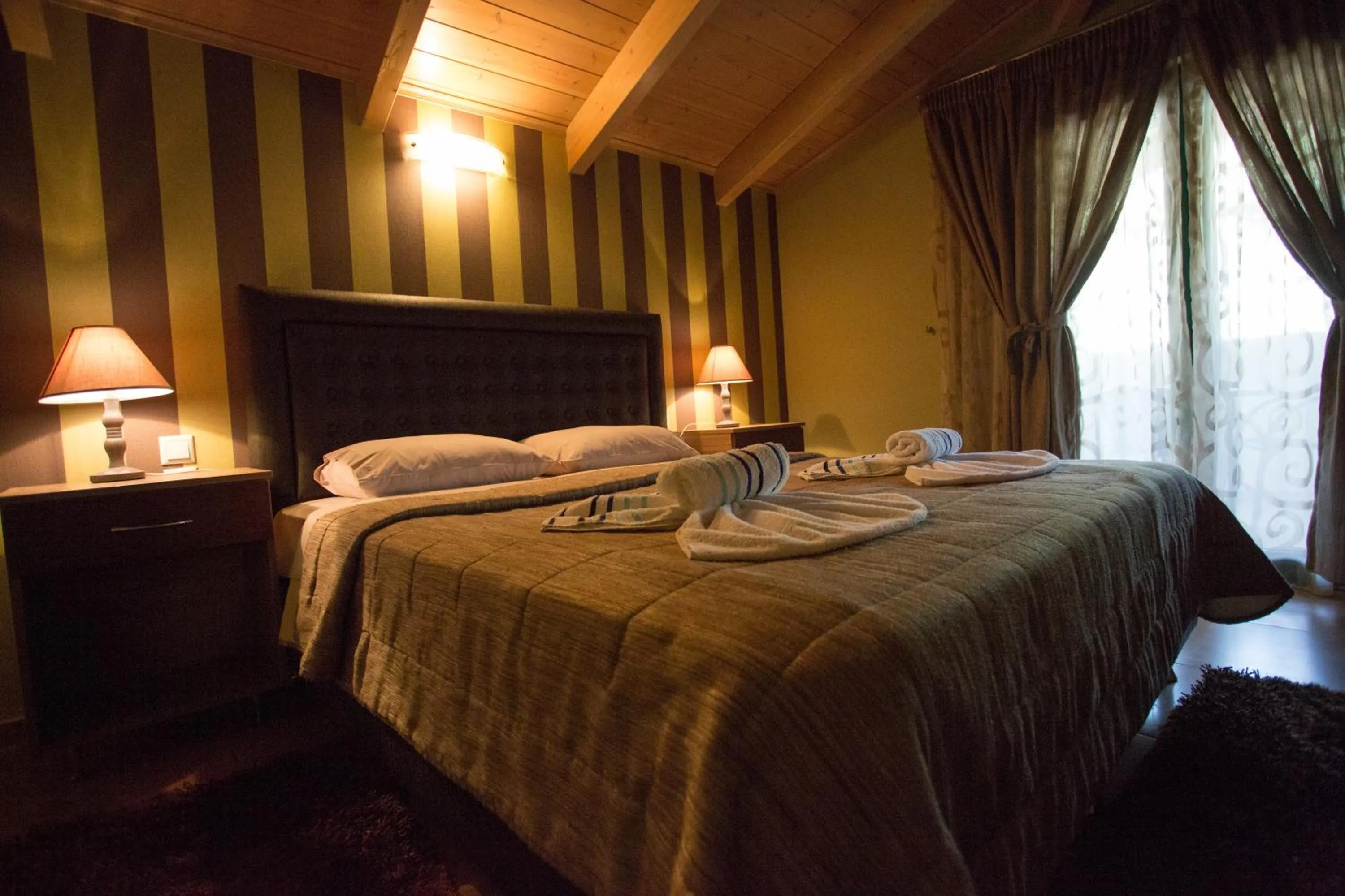 Photo of the whole room, Bed in Delfini Hotel
