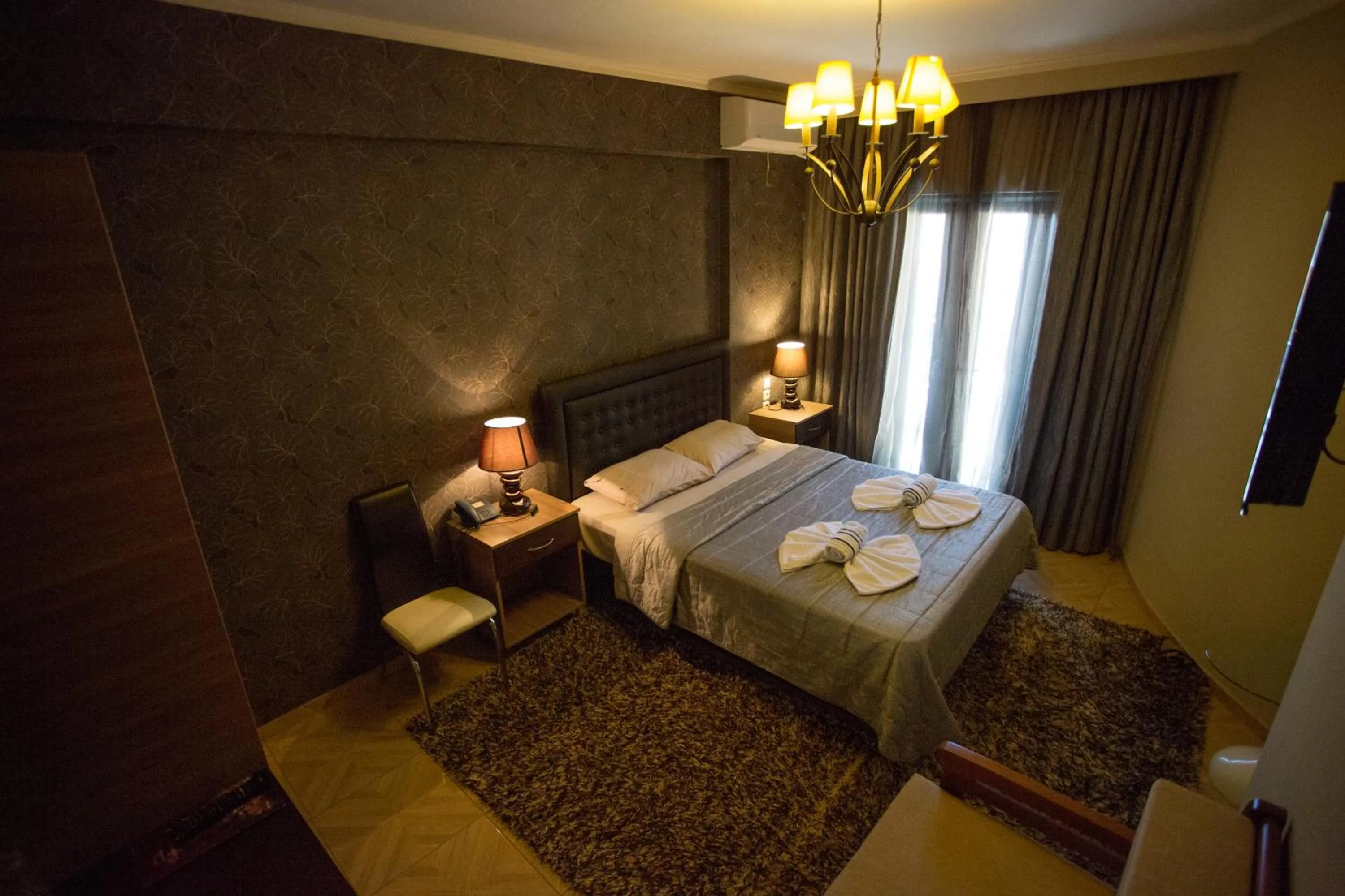 Bed in Delfini Hotel