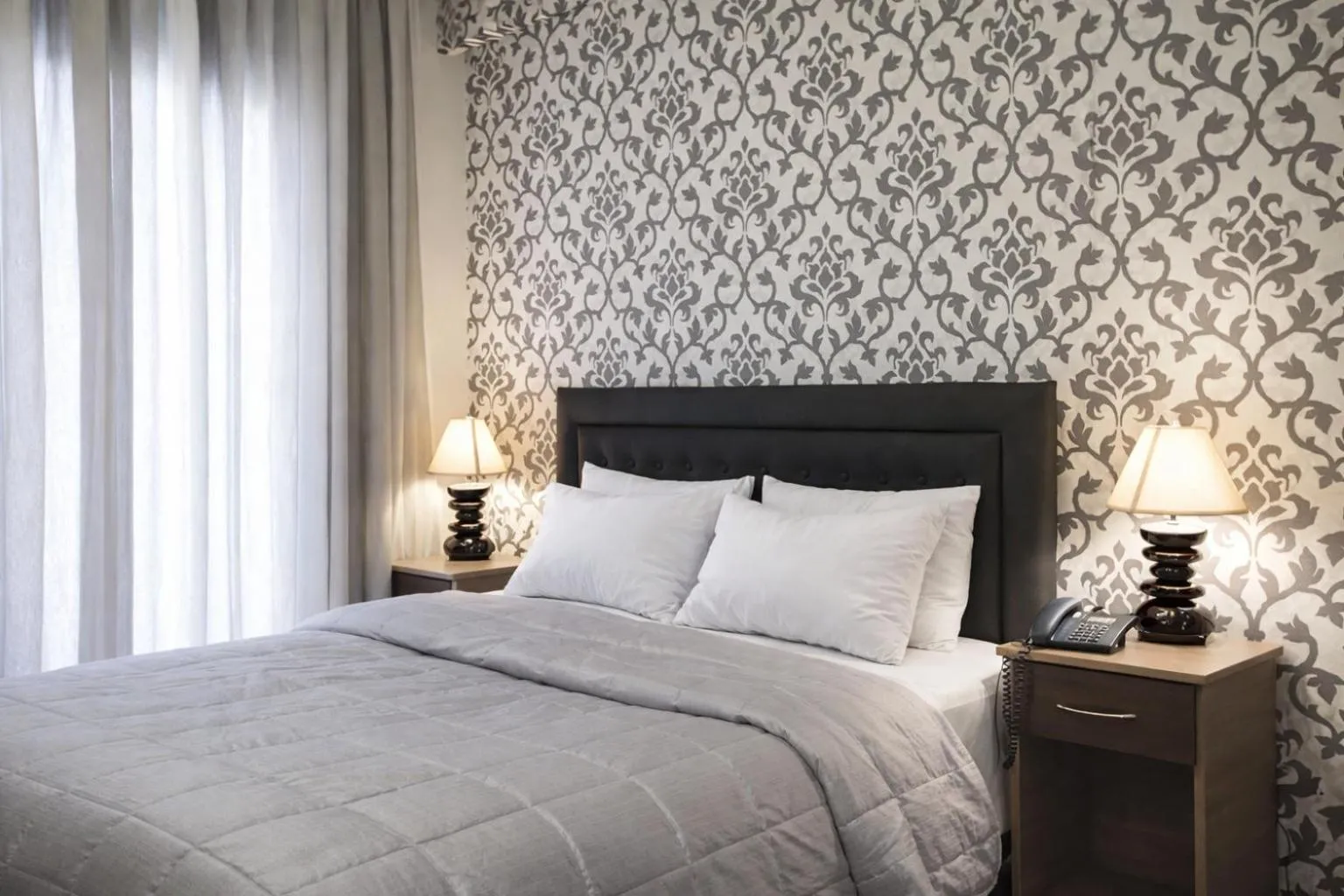 Bed in Delfini Hotel