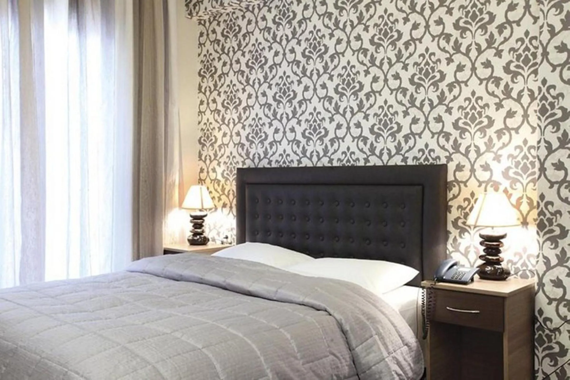 Bed in Delfini Hotel