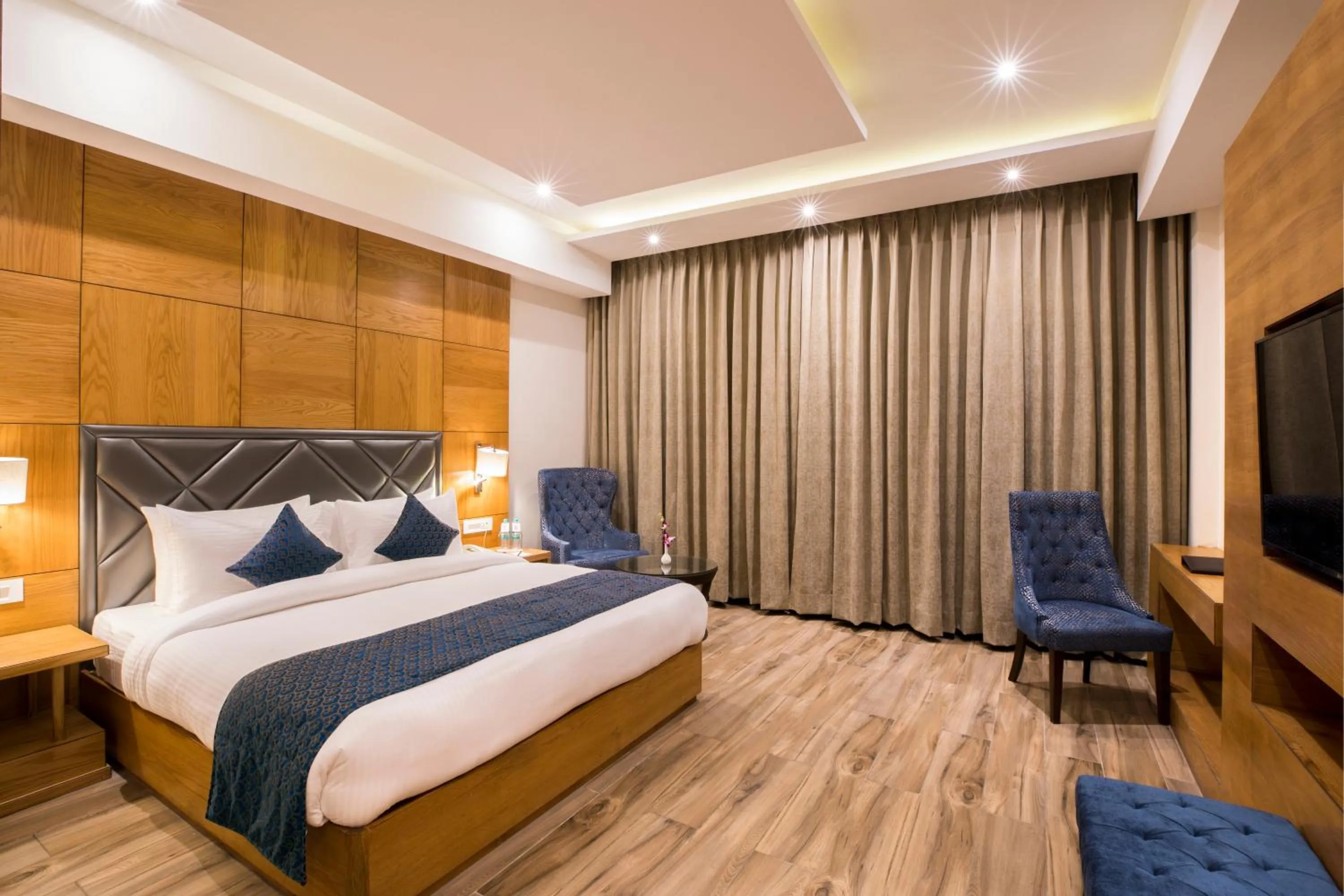 Communal lounge/ TV room, Bed in Regenta Central Cassia Zirakpur Chandigarh