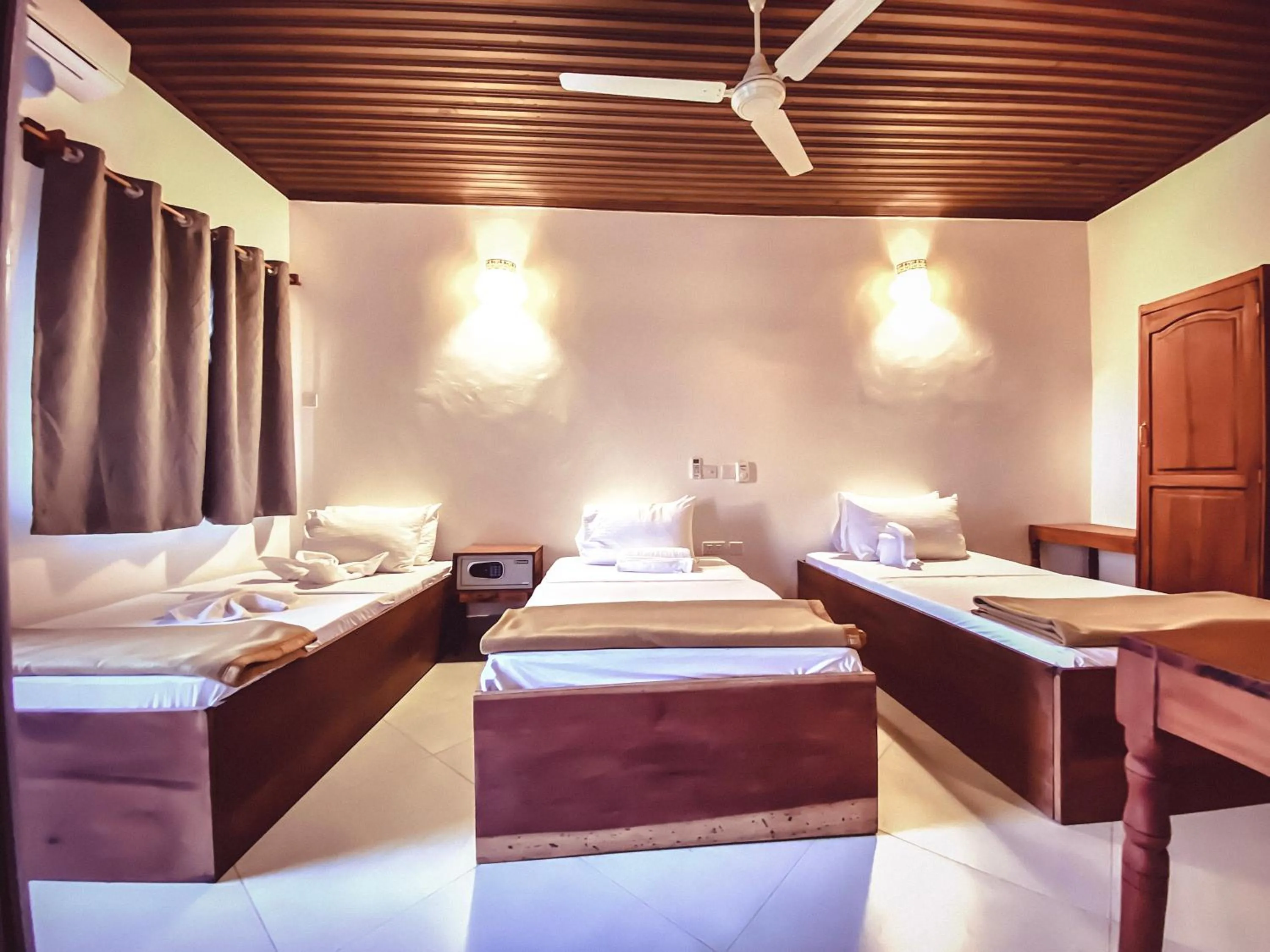 Bedroom in Smiles Stone Town Hotel