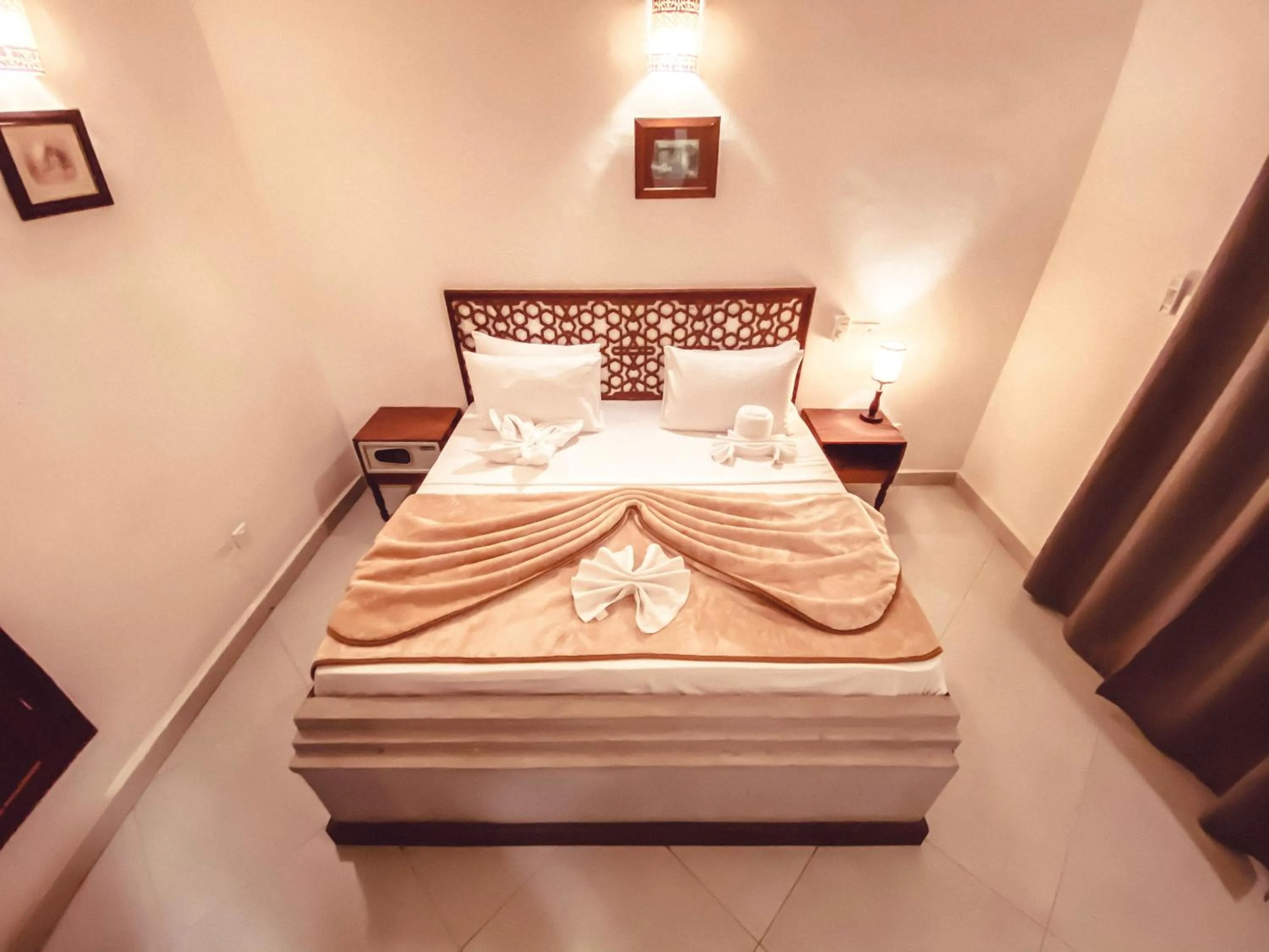 Bed in Smiles Stone Town Hotel