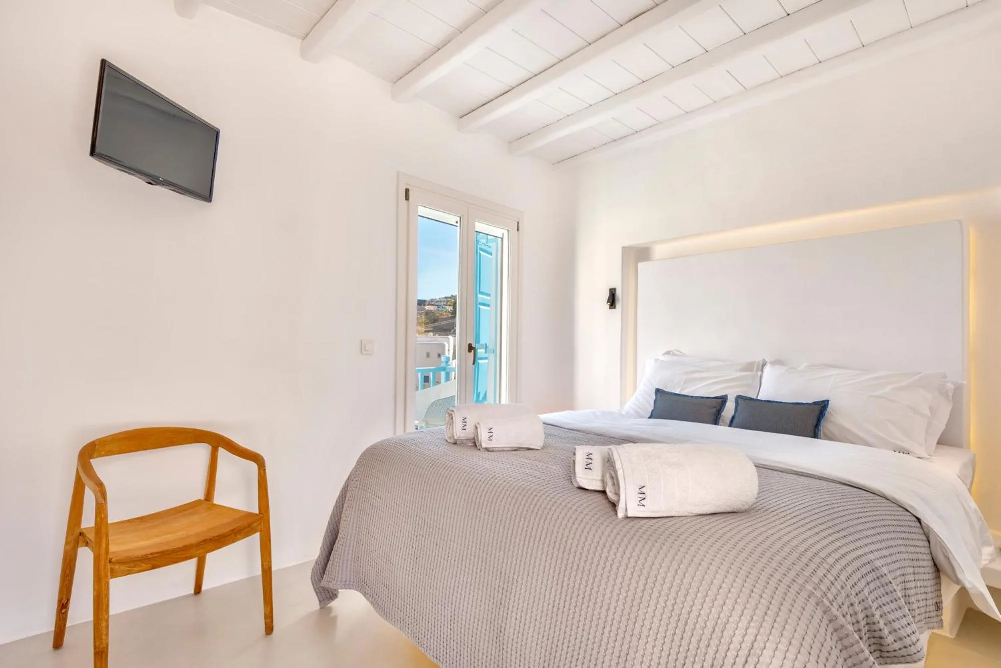 Bed in Mykonian Mews Luxury Suites