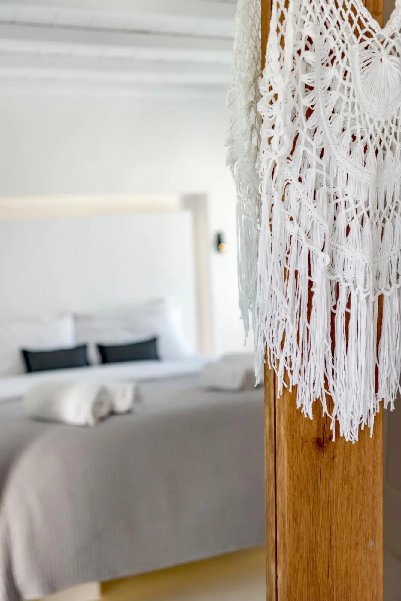 Decorative detail, Bed in Mykonian Mews Luxury Suites Decorative detail, Bed in Mykonian Mews Luxury Suites