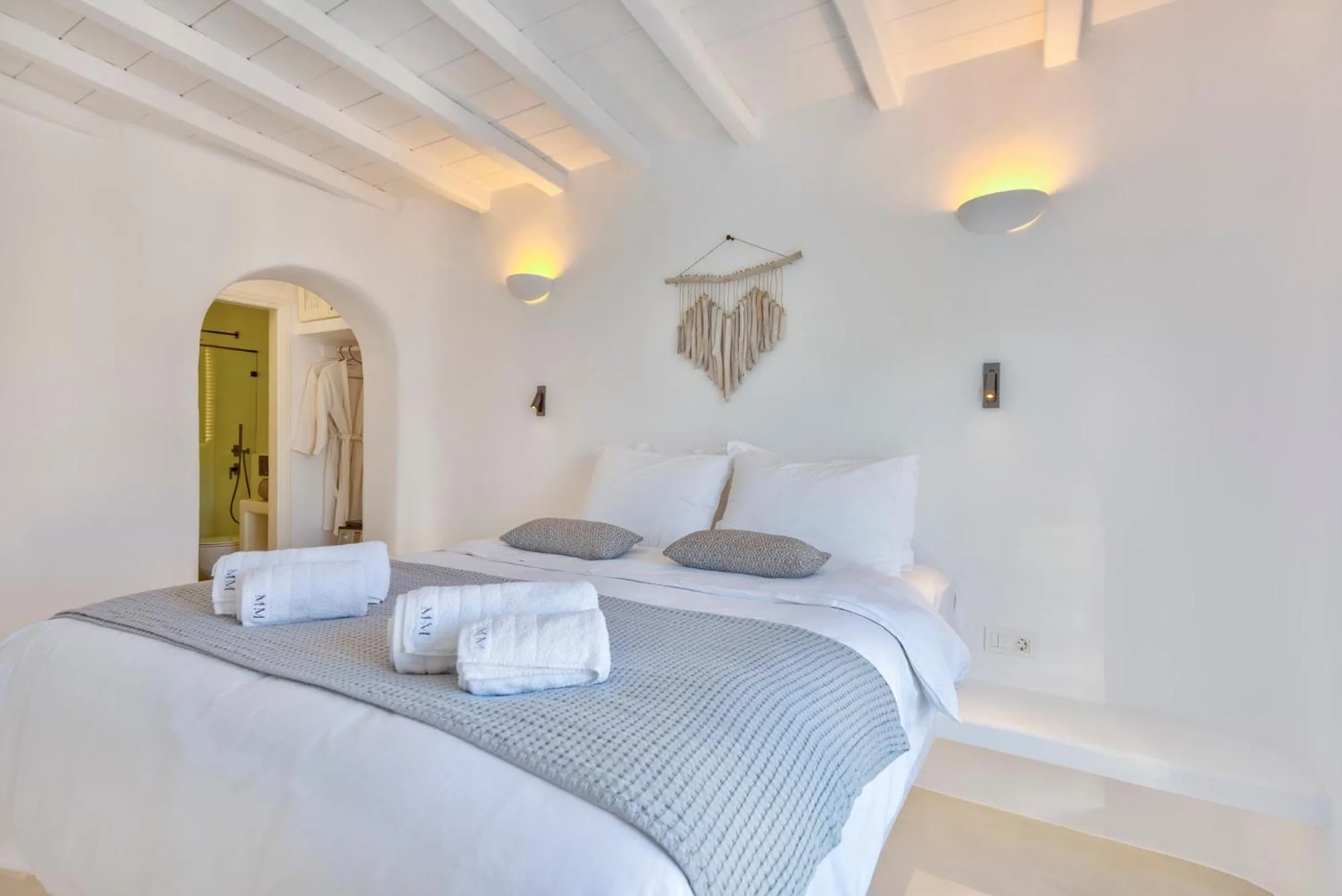 Bed in Mykonian Mews Luxury Suites