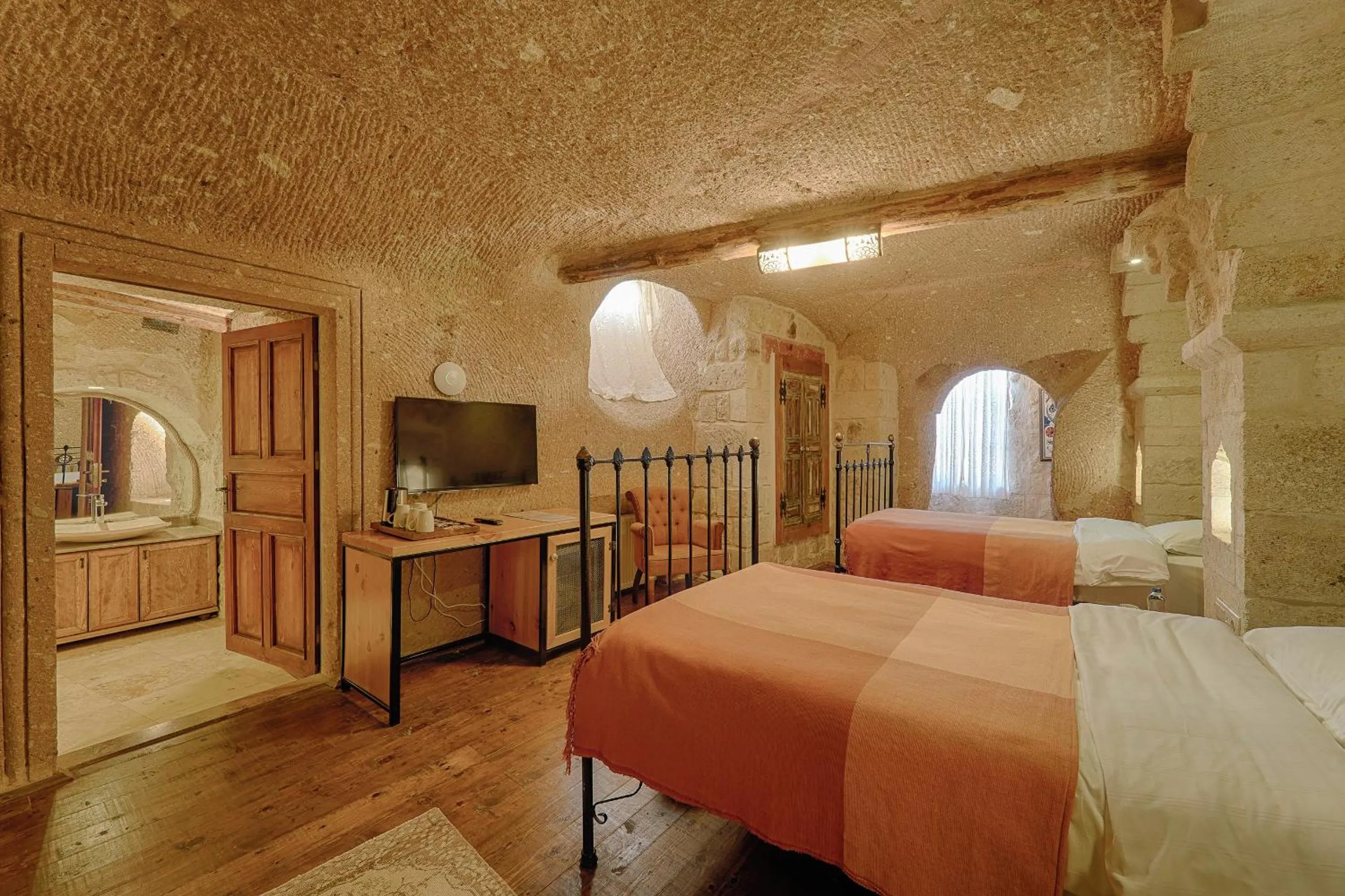 Bed in Taru Cave Suites