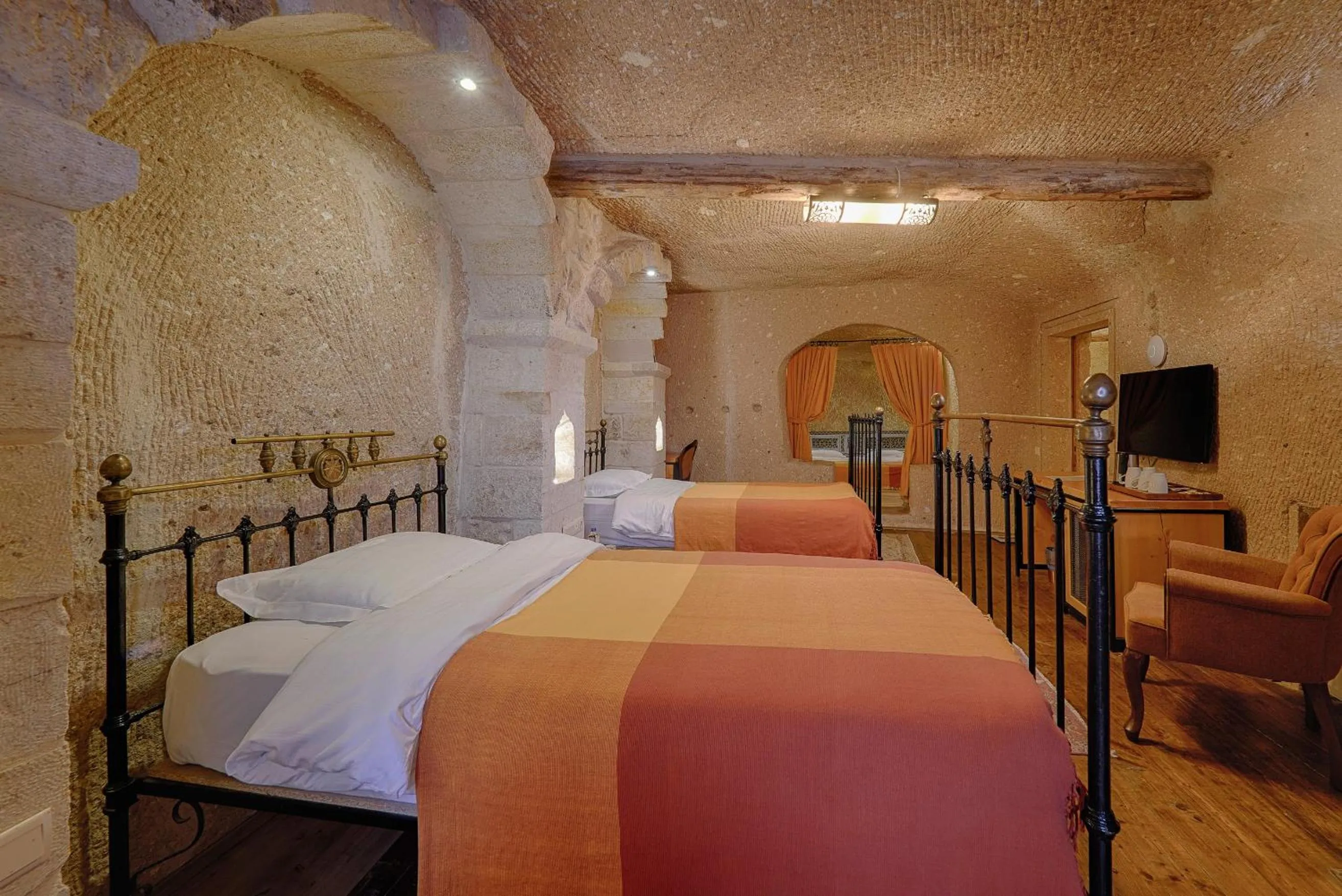Bed in Taru Cave Suites