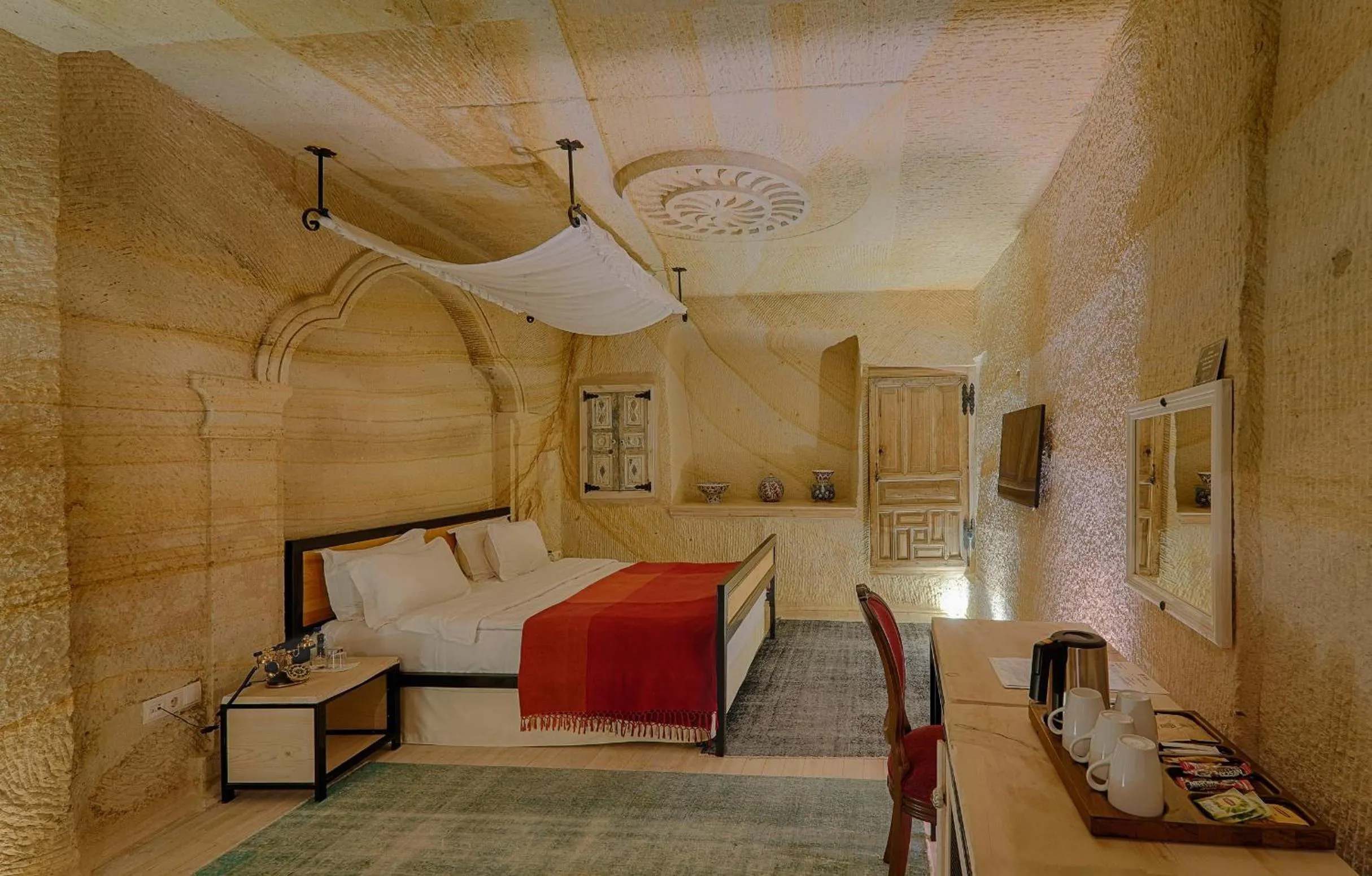 Bed in Taru Cave Suites