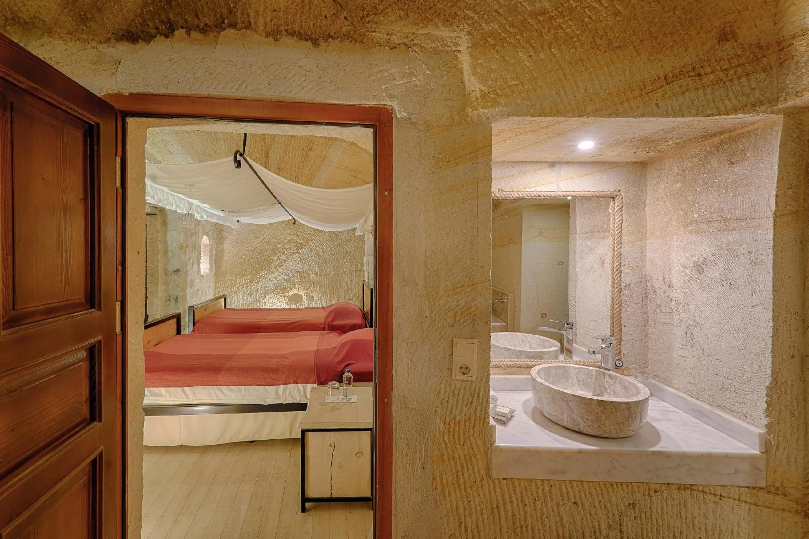 Bed in Taru Cave Suites