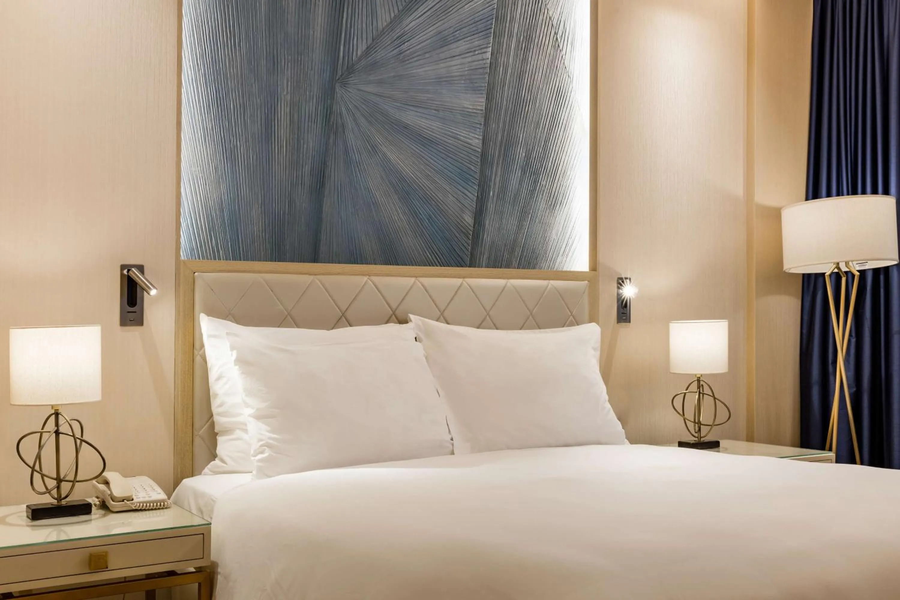 Bed in The Diplomat Radisson Blu Hotel Residence & Spa