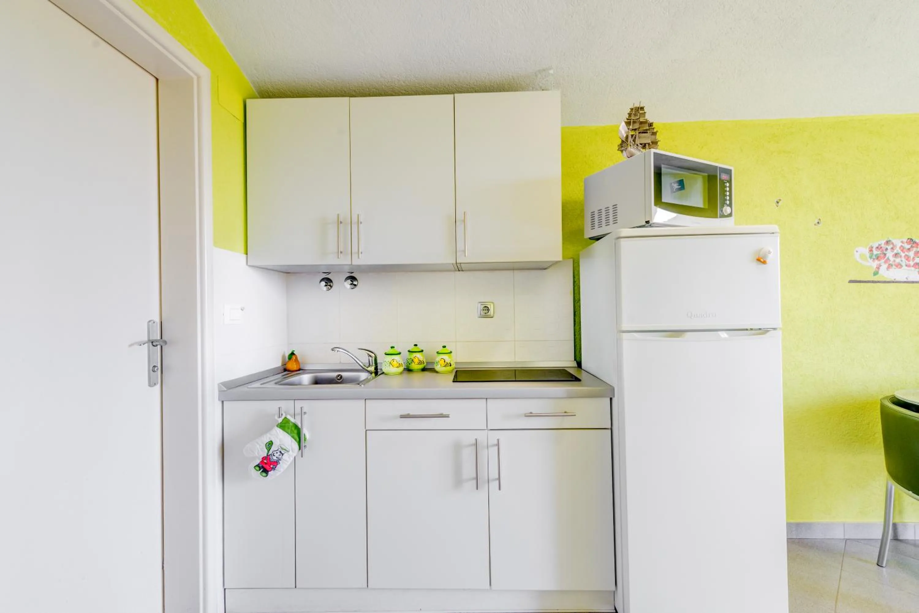 Kitchen or kitchenette in Apartments Petra