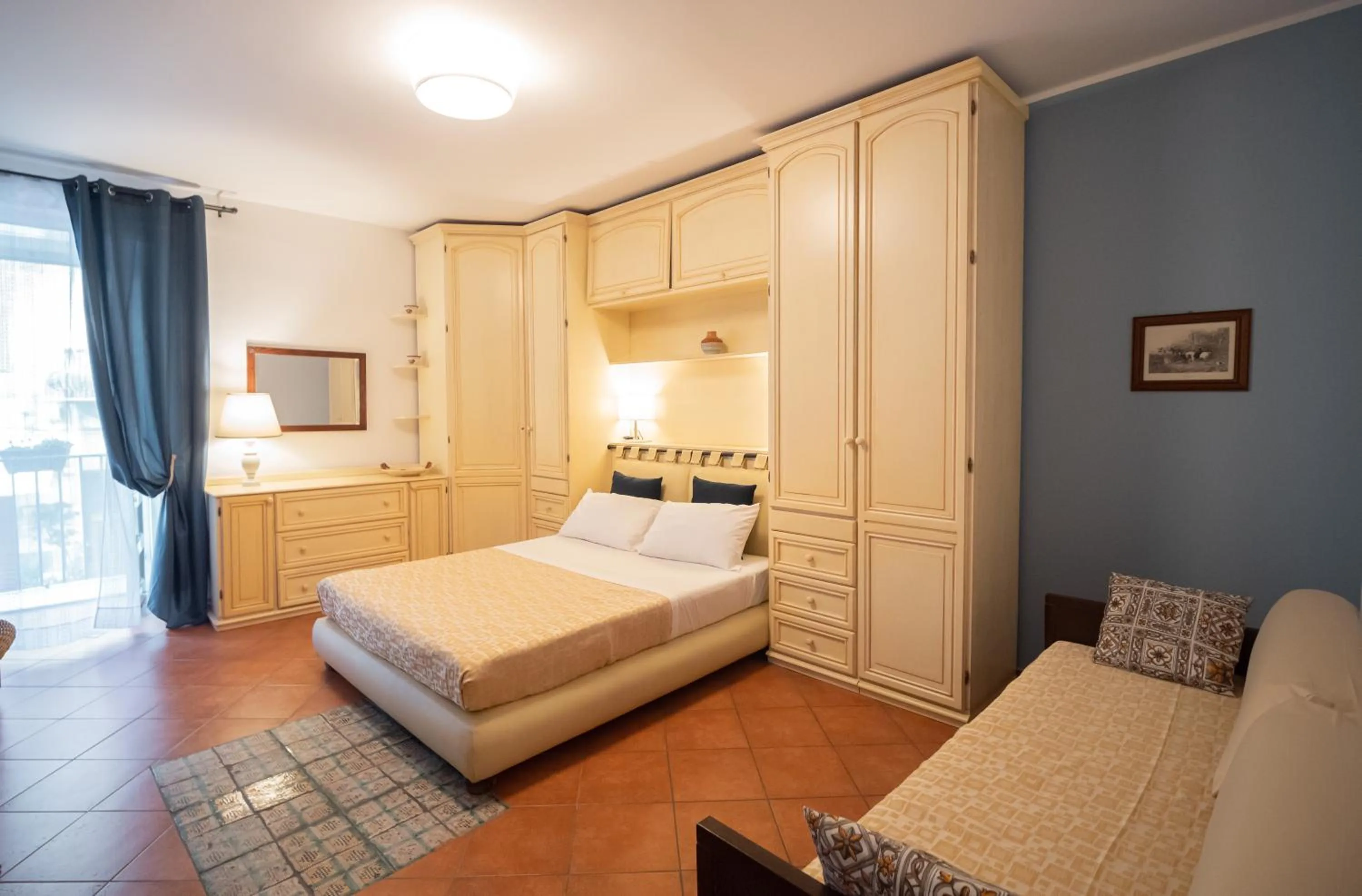 Bed in Kalamarina Rooms