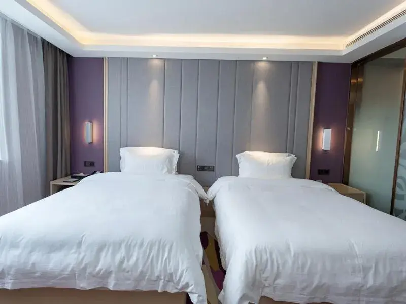 Bed in Lavande Hotel (Yongxin Bubugao Times Square) Bed in Lavande Hotel (Yongxin Bubugao Times Square)