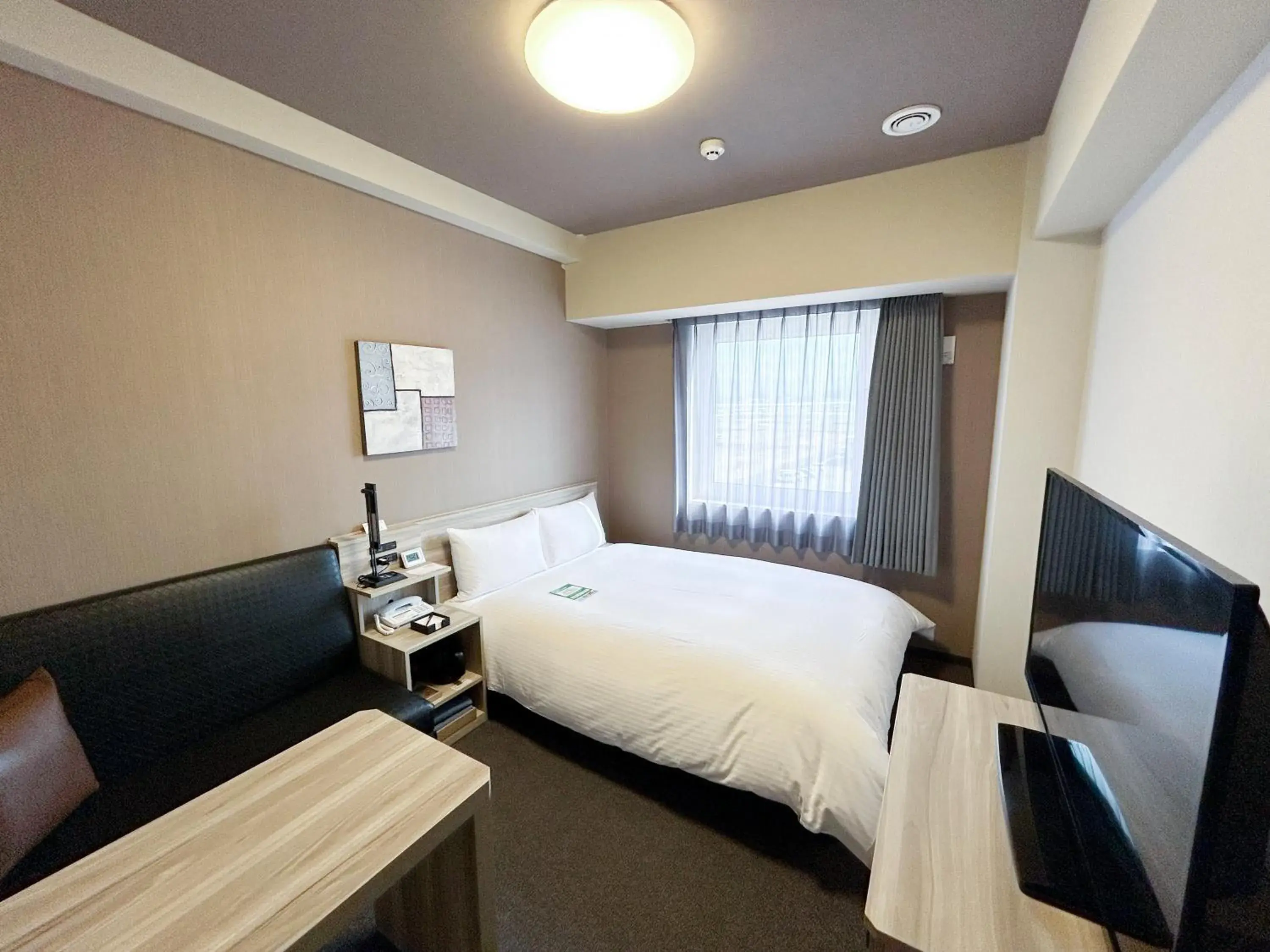 Photo of the whole room, Bed in Hotel Route-Inn Takefu Inter Photo of the whole room, Bed in Hotel Route-Inn Takefu Inter