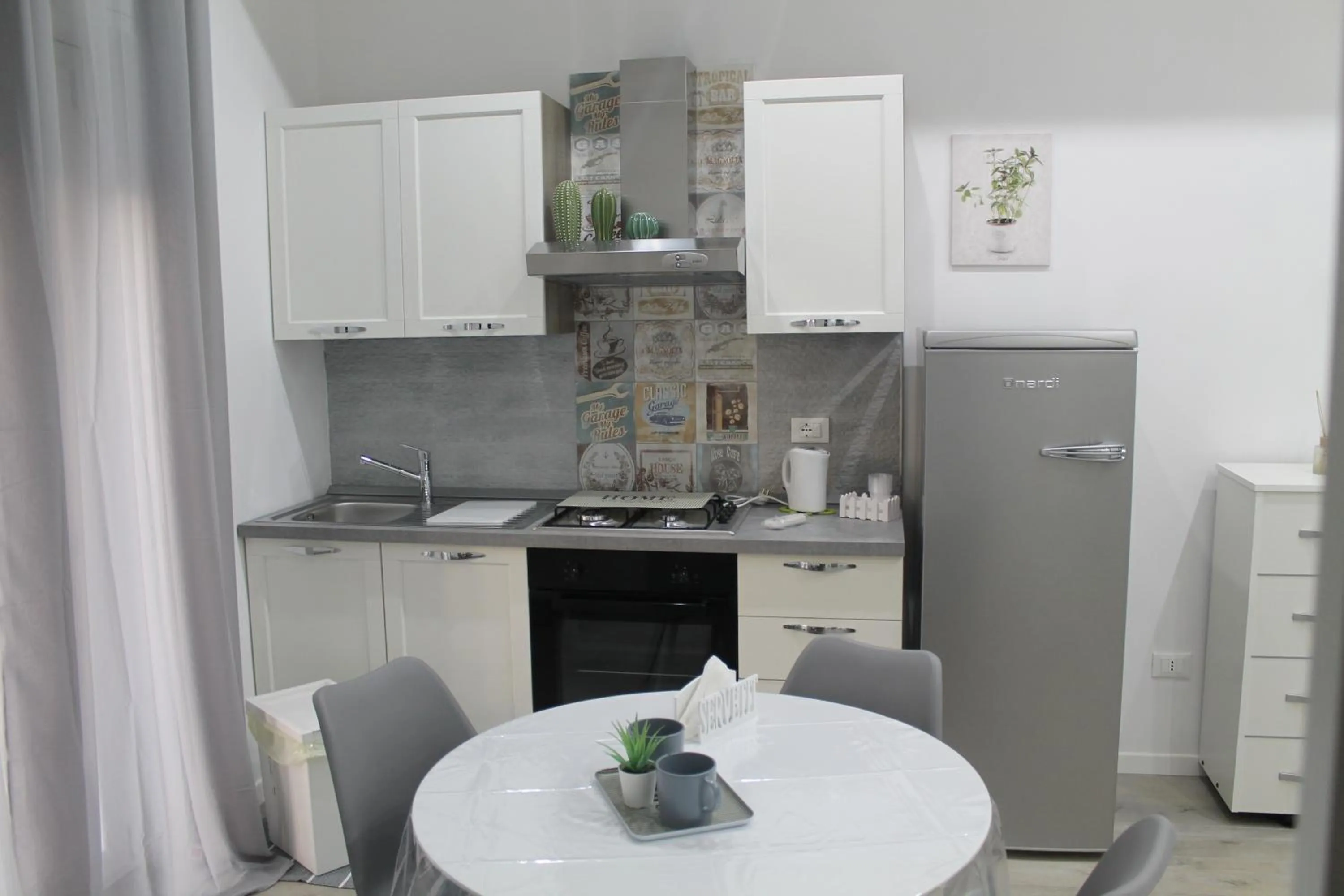 Kitchen or kitchenette in Vacanze HOME