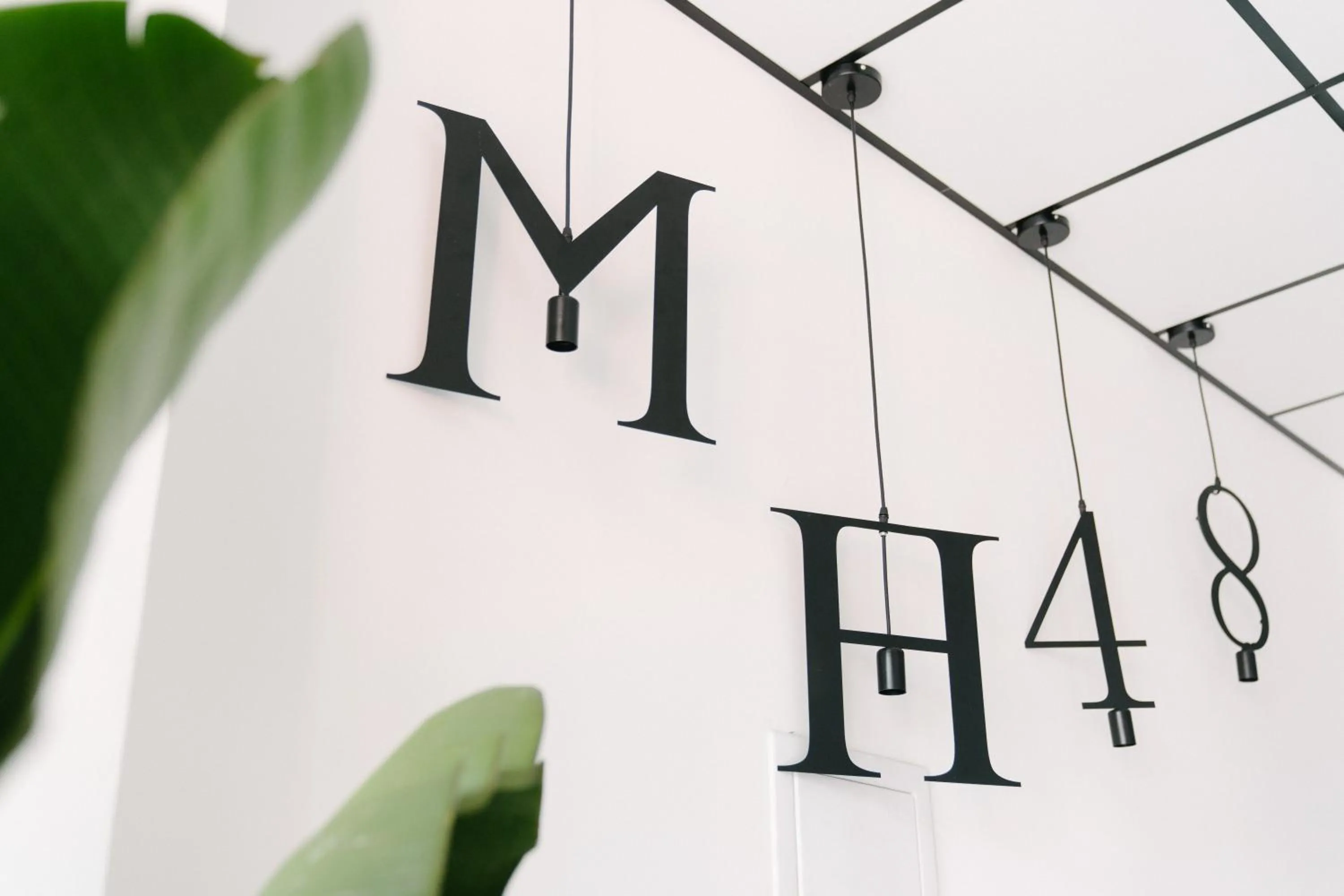 Property logo or sign in MH48 Hotel