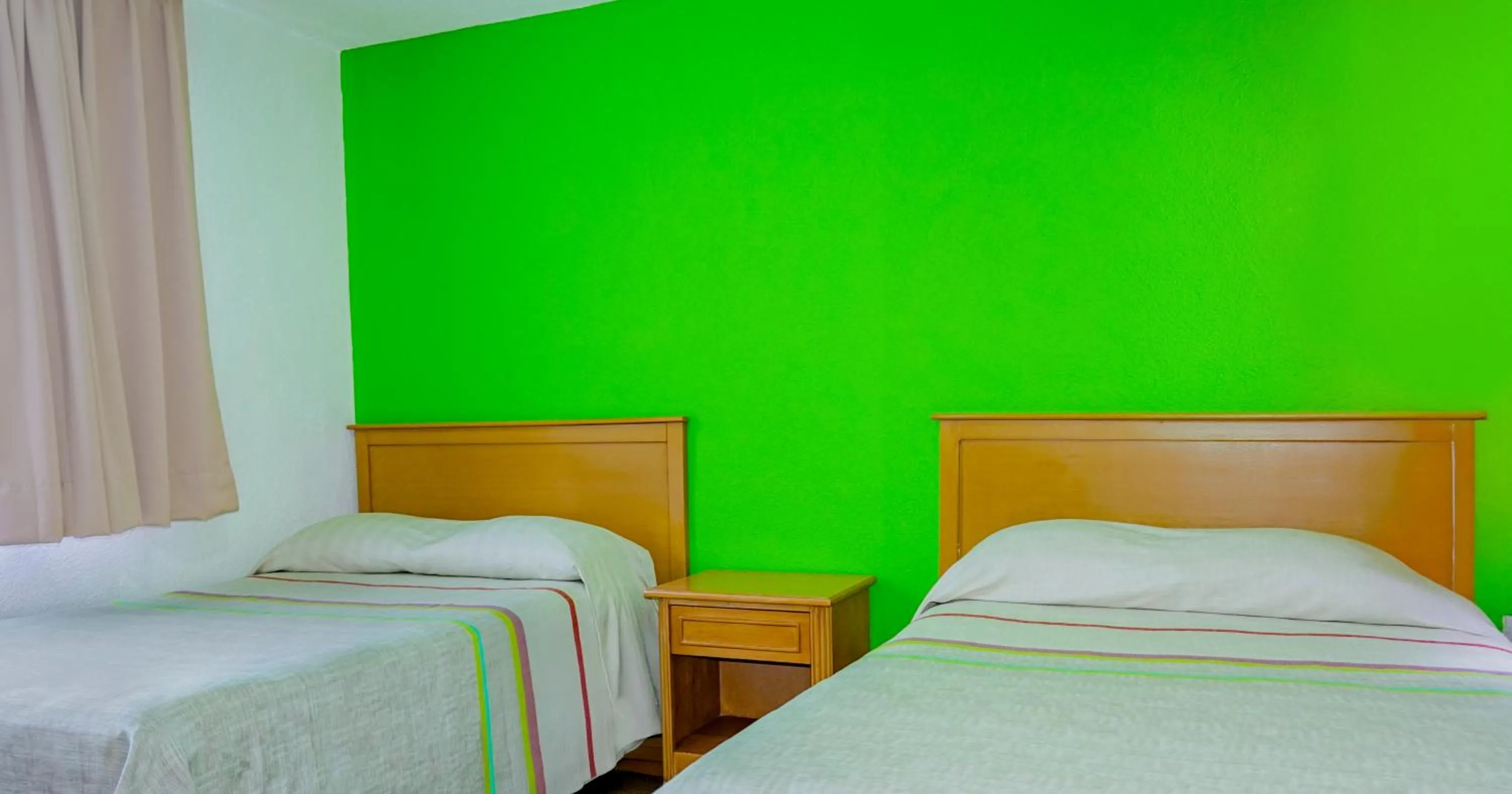 Bed in Sunrock Hotel & Suites