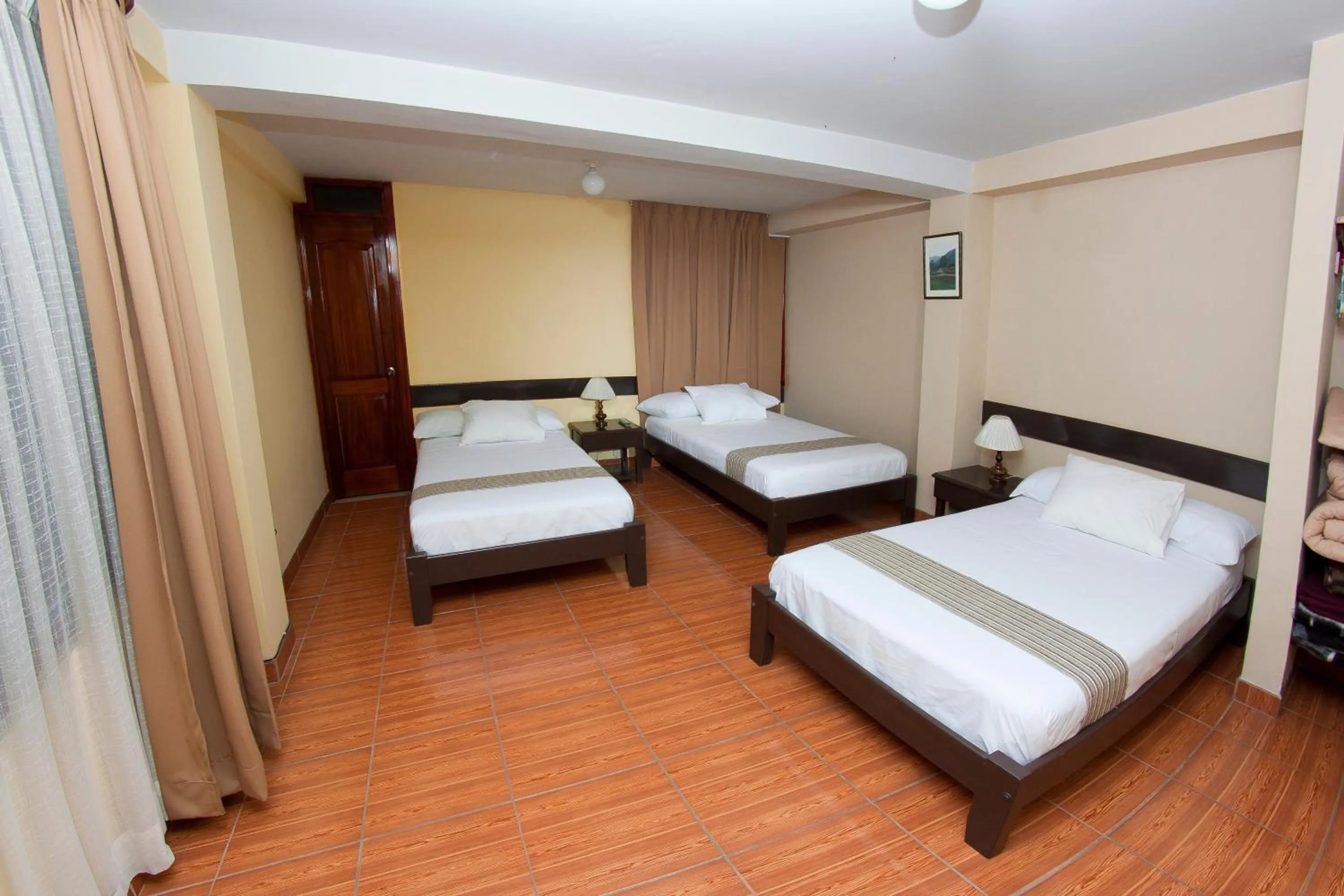 Bed in Yucay Plaza Inn