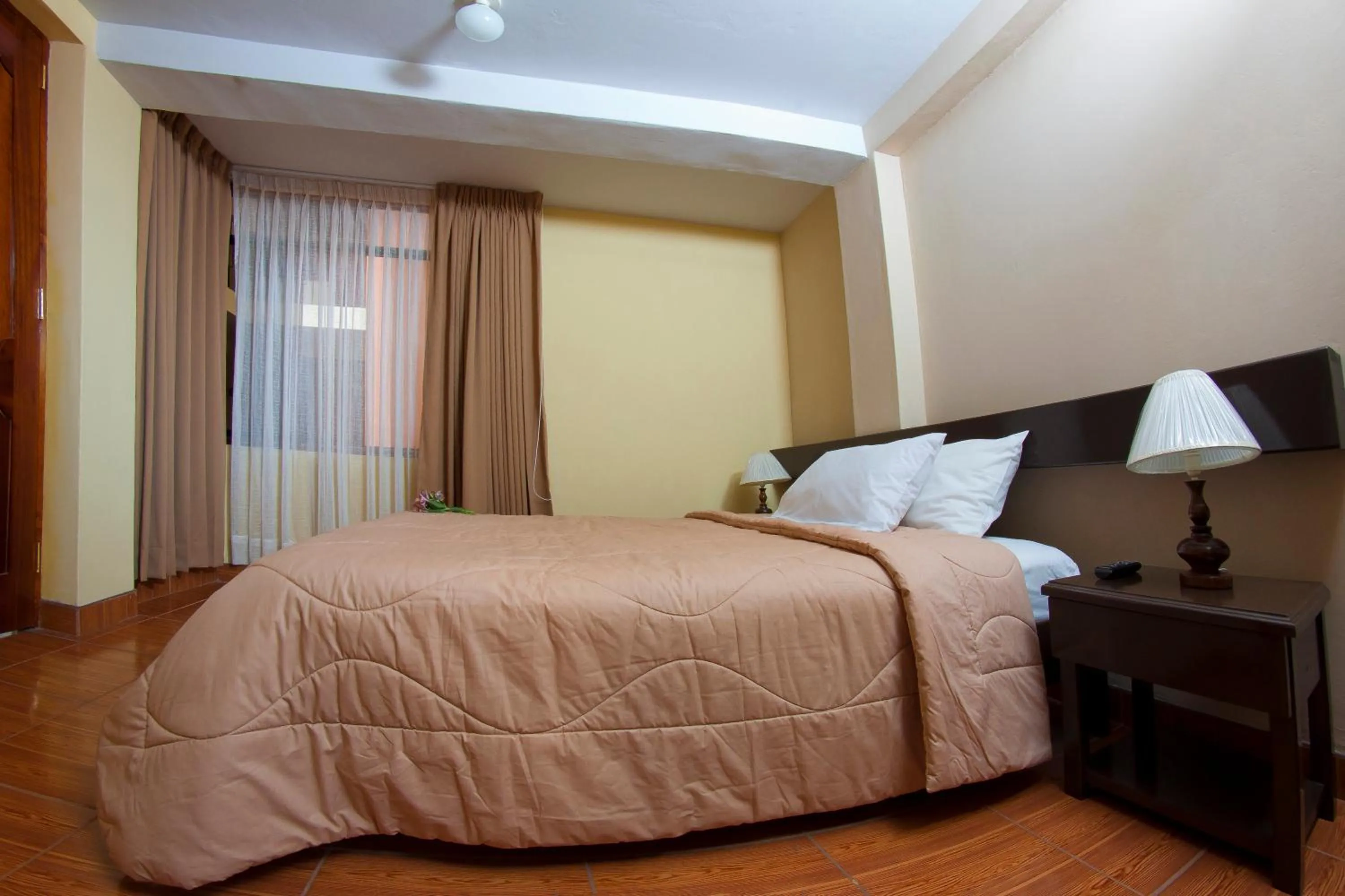 Bed in Yucay Plaza Inn