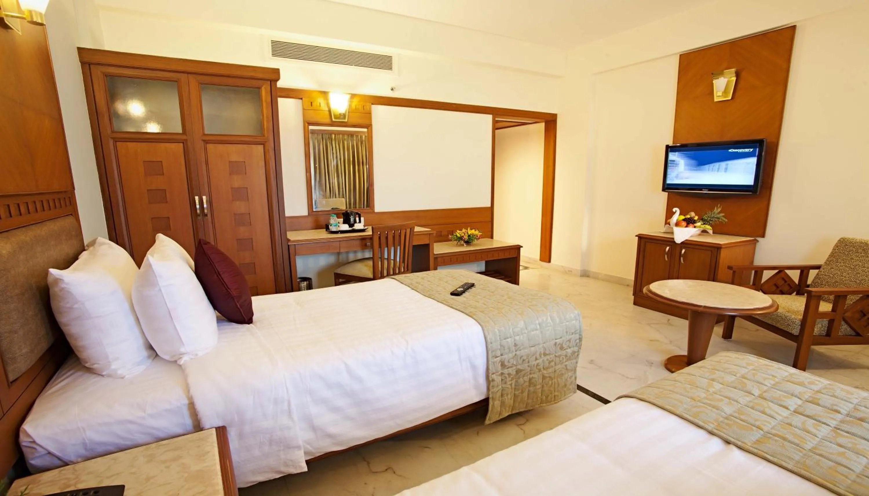 Photo of the whole room, Bed in JP Chennai Hotel