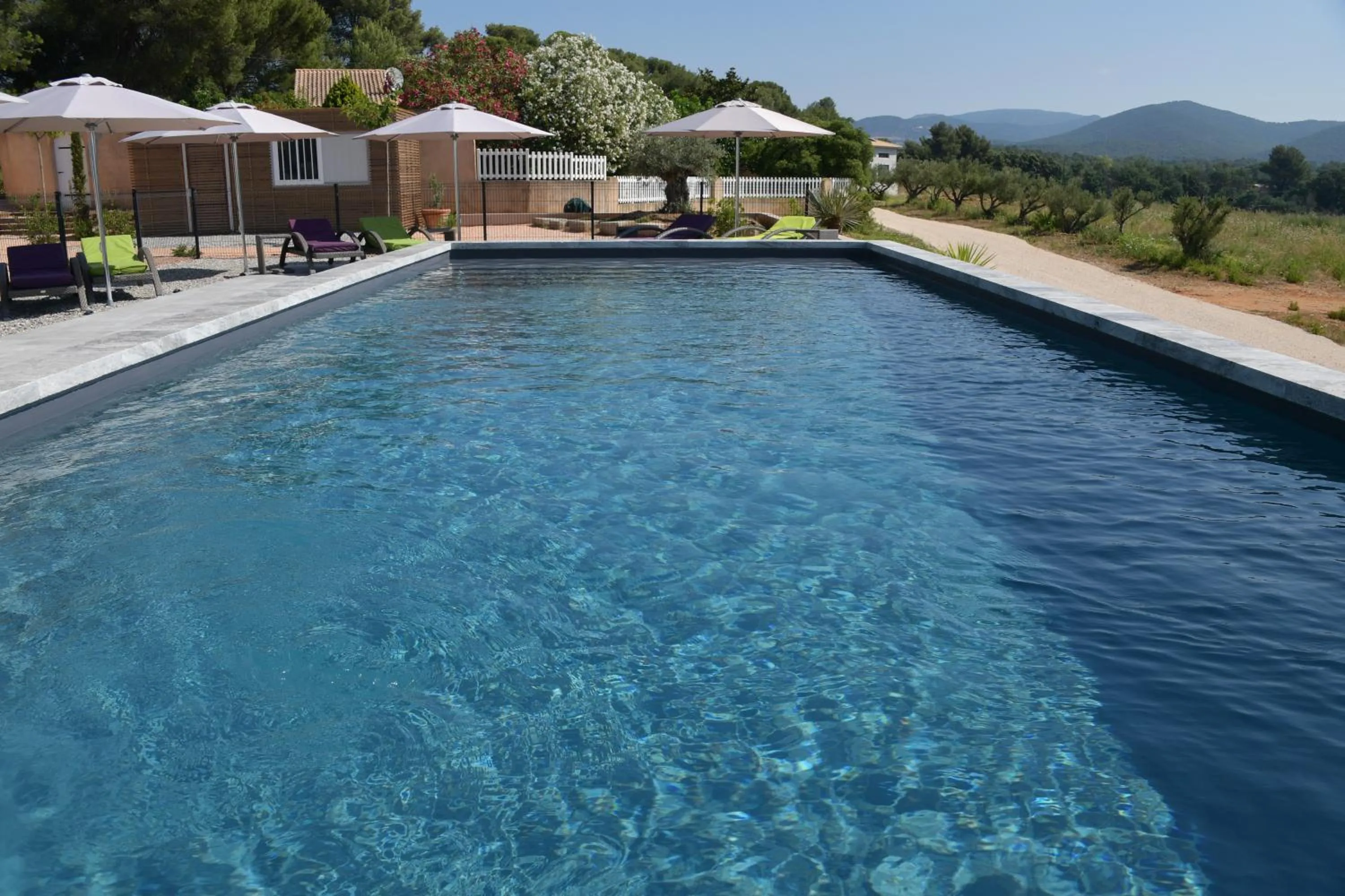 Swimming pool in Sous Les Pins gîtes et chambres d'hôtes