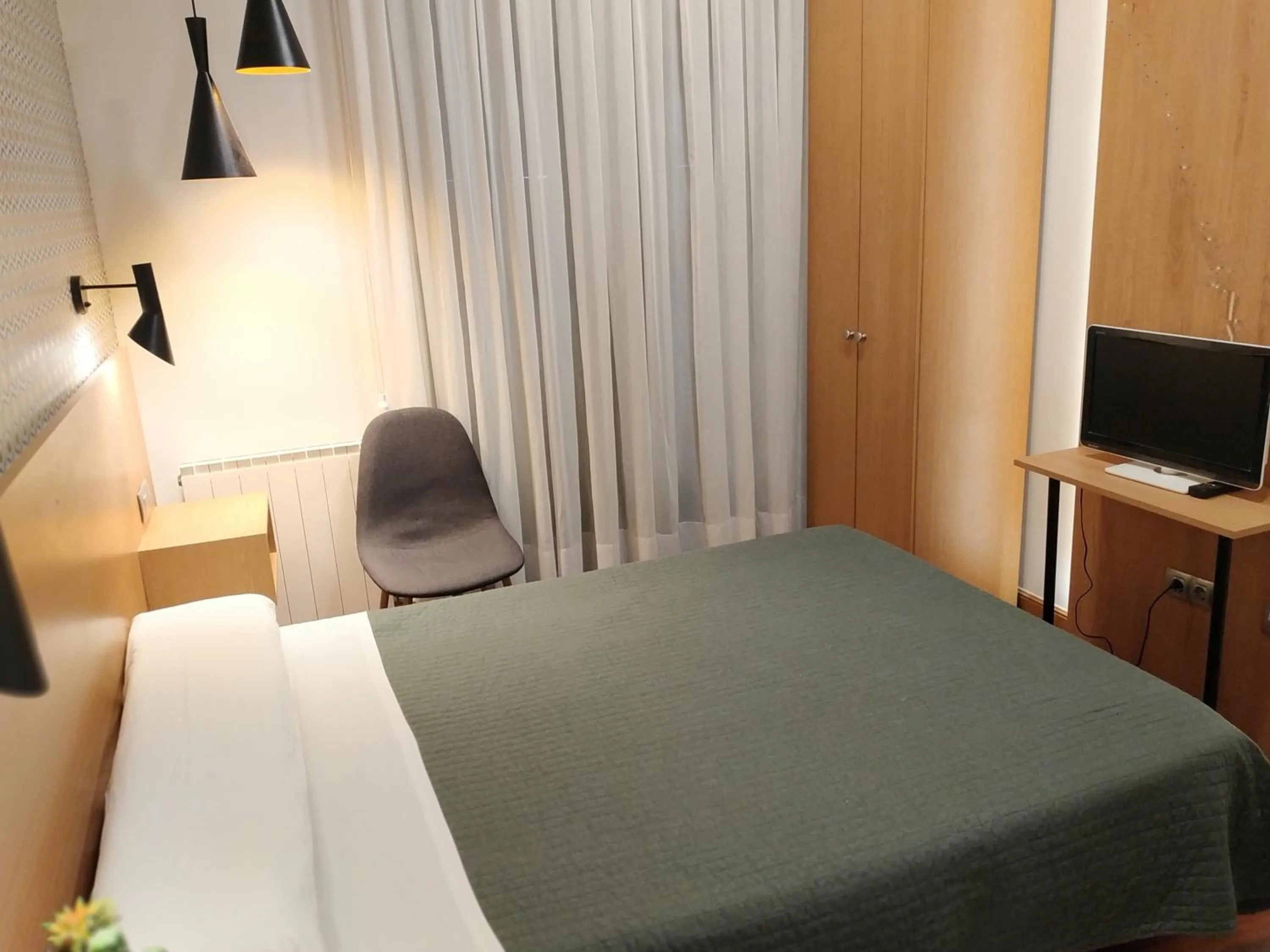 Bed in Roquefer Bilbao Central Rooms