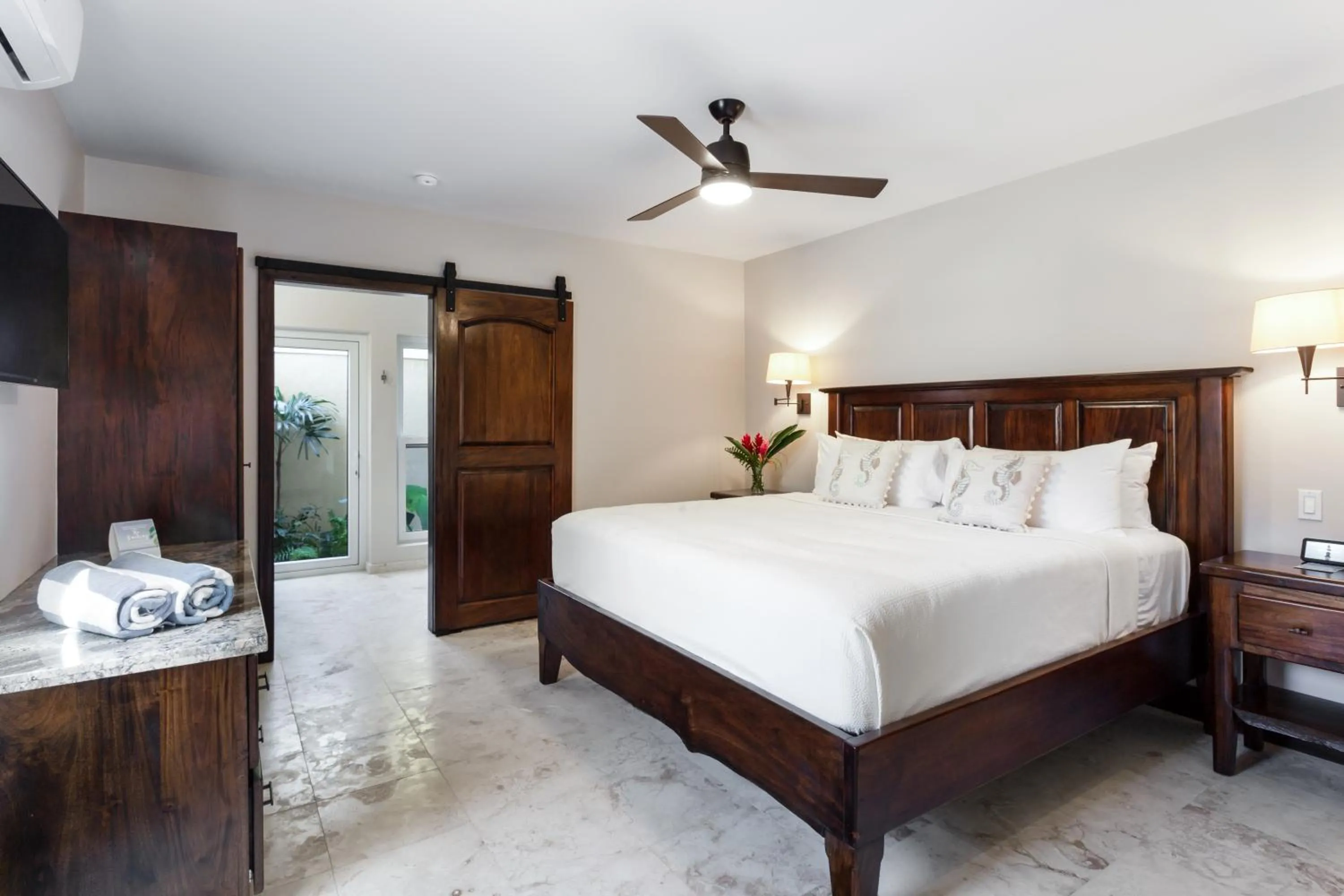 Bed in Sirenian Bay Resort -Villas & All Inclusive Bungalows