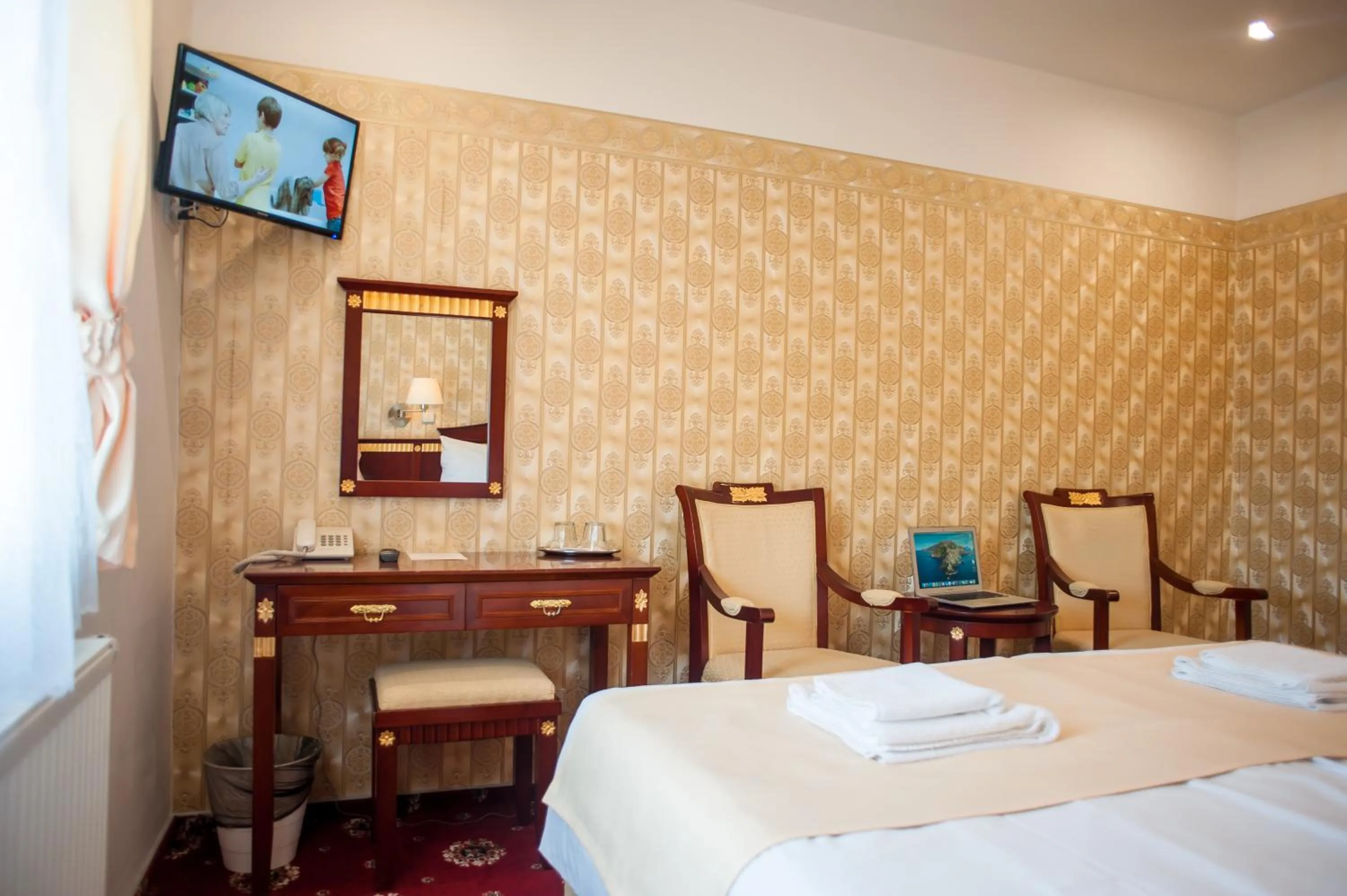 Bed in Hotel Tommy Wellness & Spa