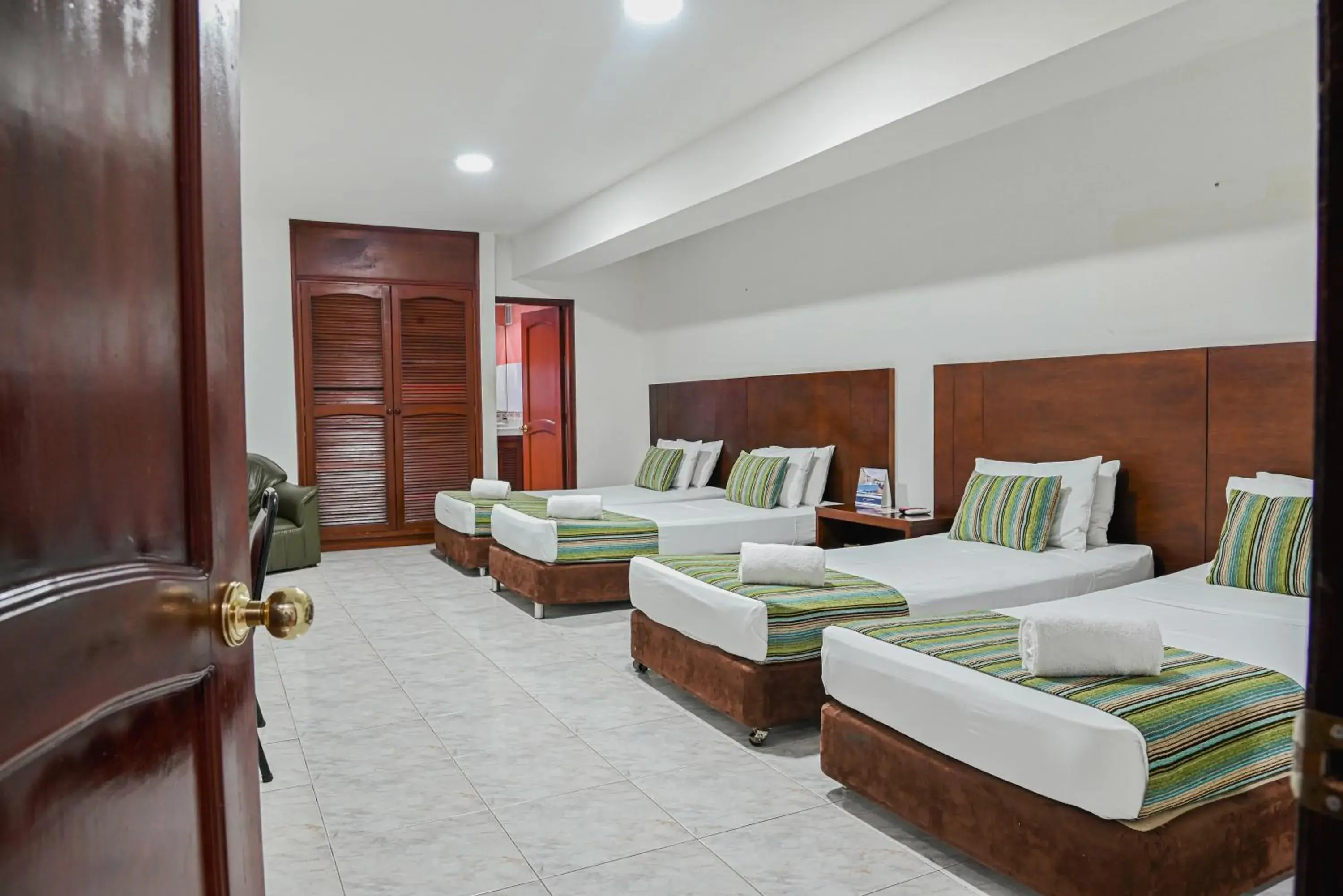 Decorative detail, Bed in TAMA Hotel Granada Real Cali Decorative detail, Bed in TAMA Hotel Granada Real Cali