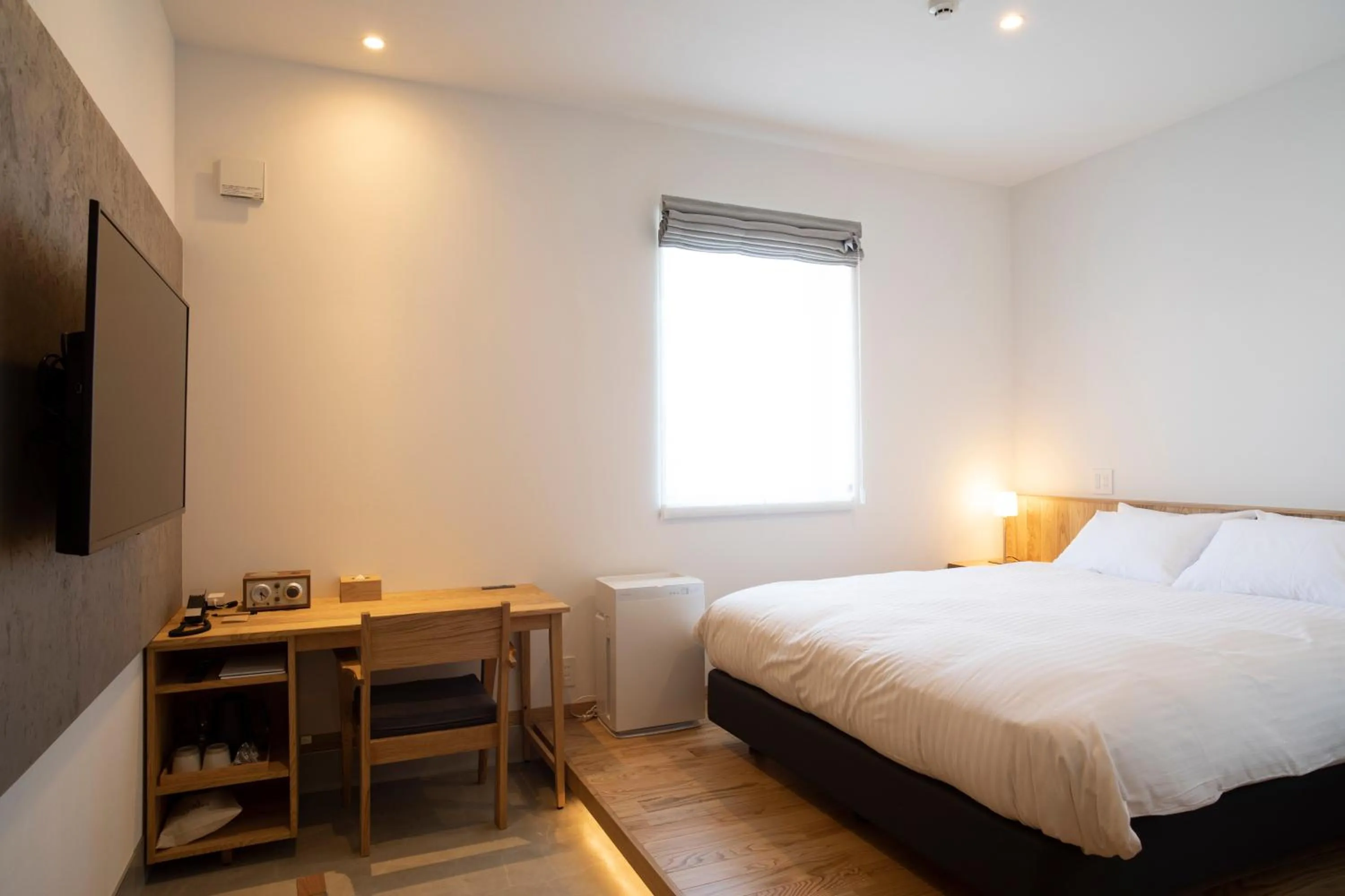 Bed in MASCOS HOTEL Masuda Onsen