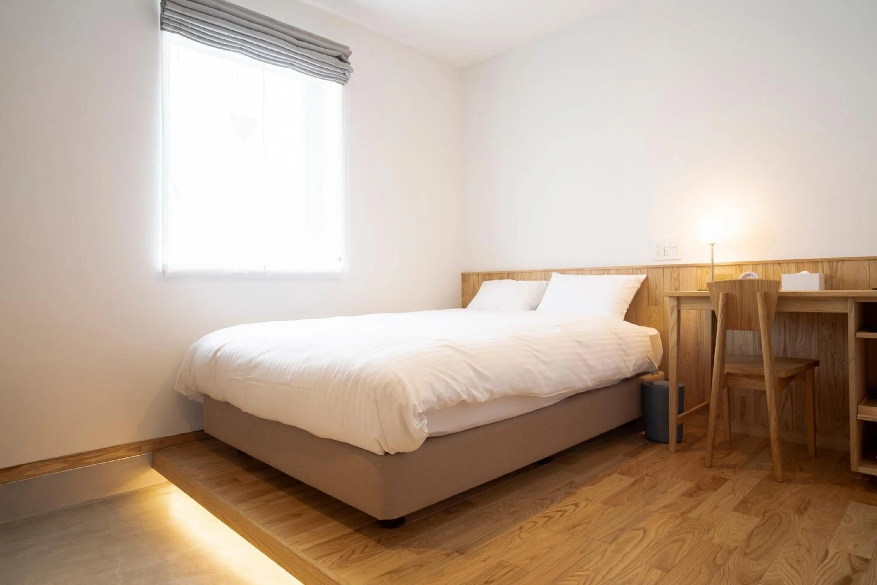 Bed in MASCOS HOTEL Masuda Onsen