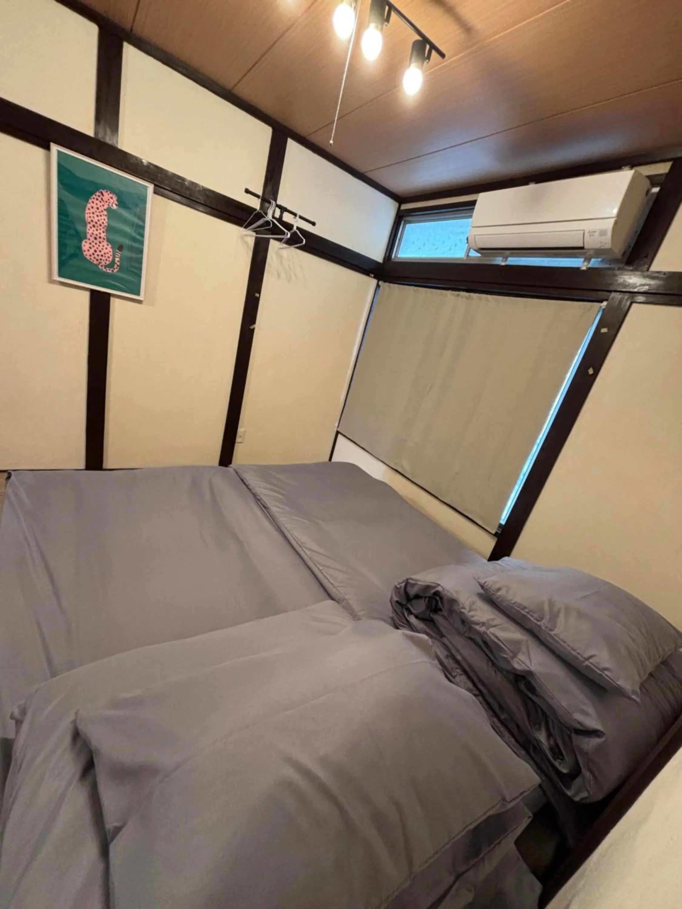 Bed in 777 Takamatsu Guest House