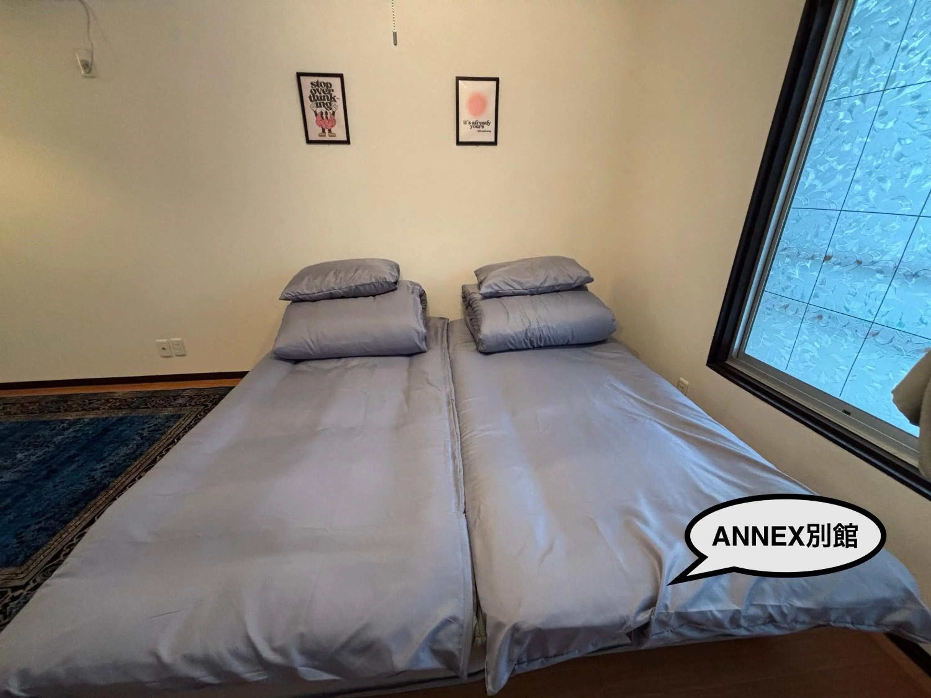 Bed in 777 Takamatsu Guest House