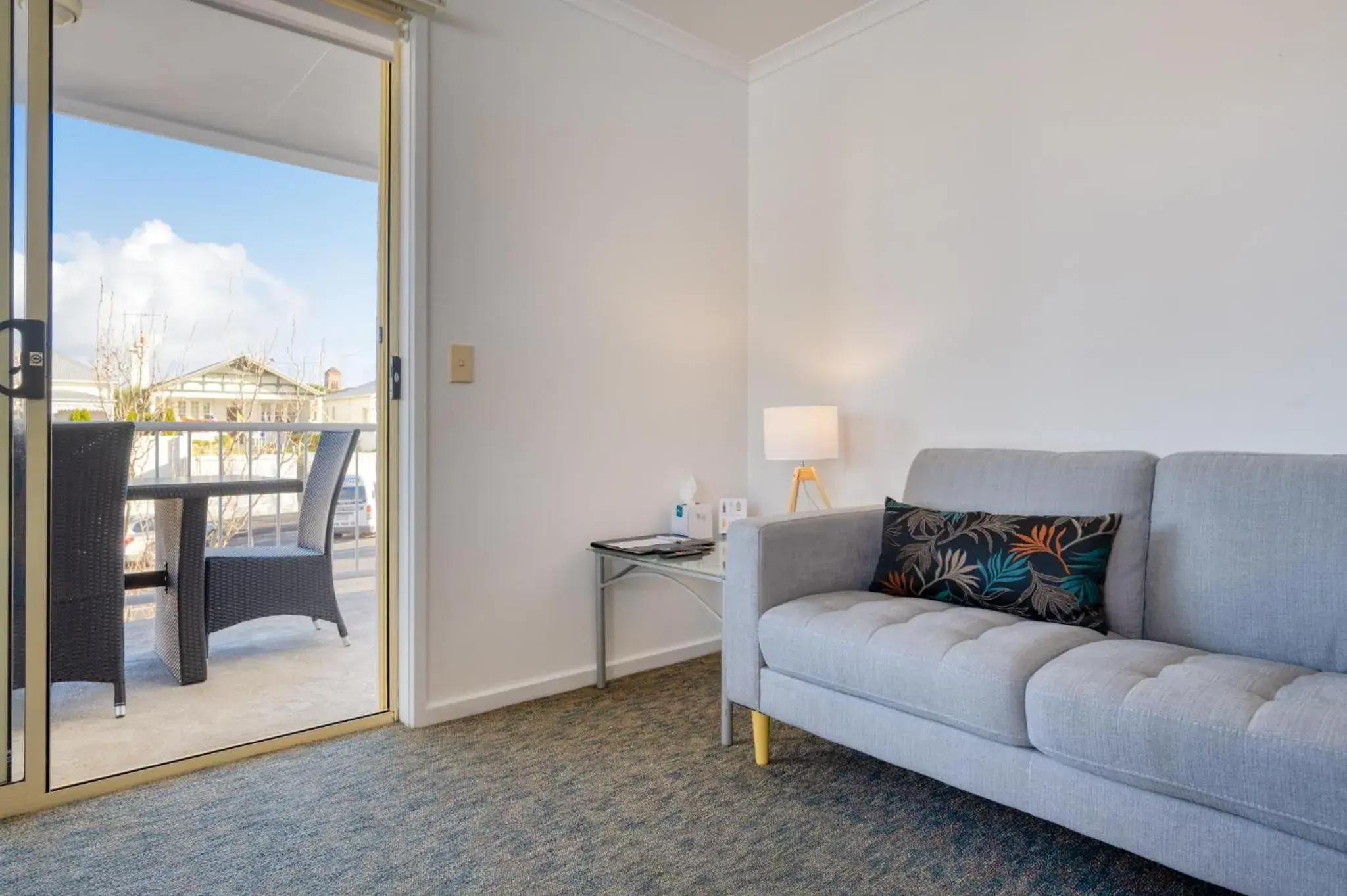 Living room in Waves on Banyan formerly Comfort Inn International Living room in Waves on Banyan formerly Comfort Inn International