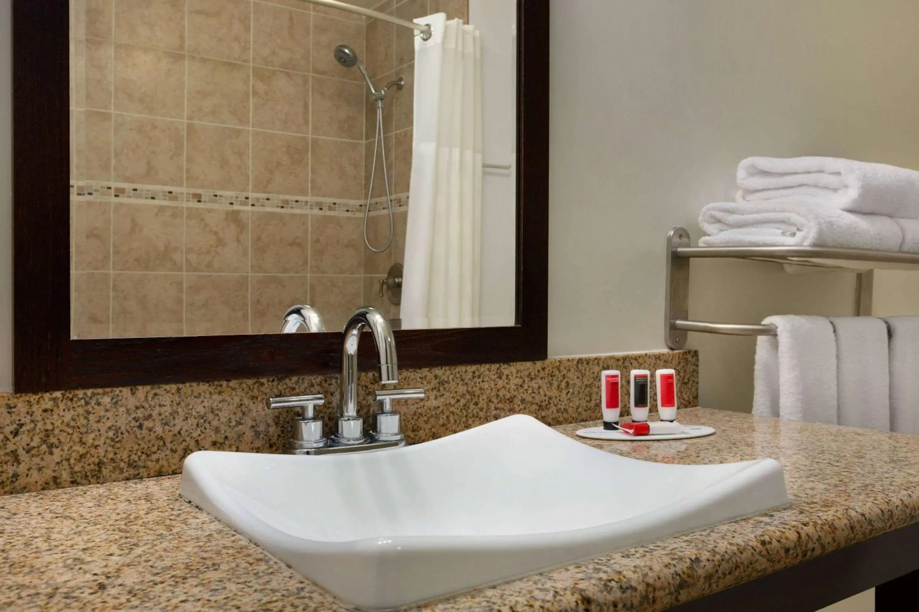 Bathroom in Ramada by Wyndham Oakland Downtown City Center Bathroom in Ramada by Wyndham Oakland Downtown City Center