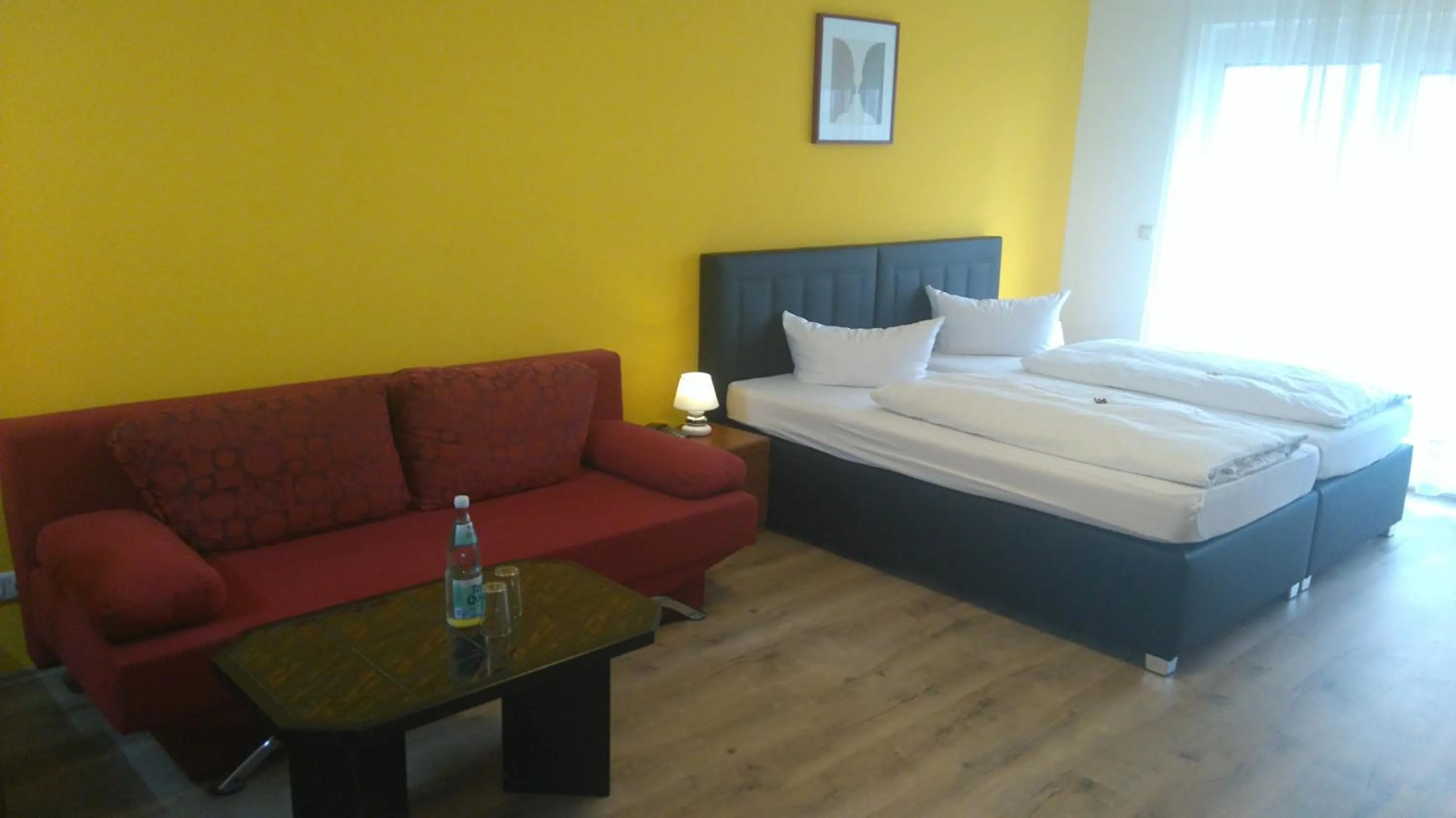 Photo of the whole room, Bed in Hotel Arheilger Hof