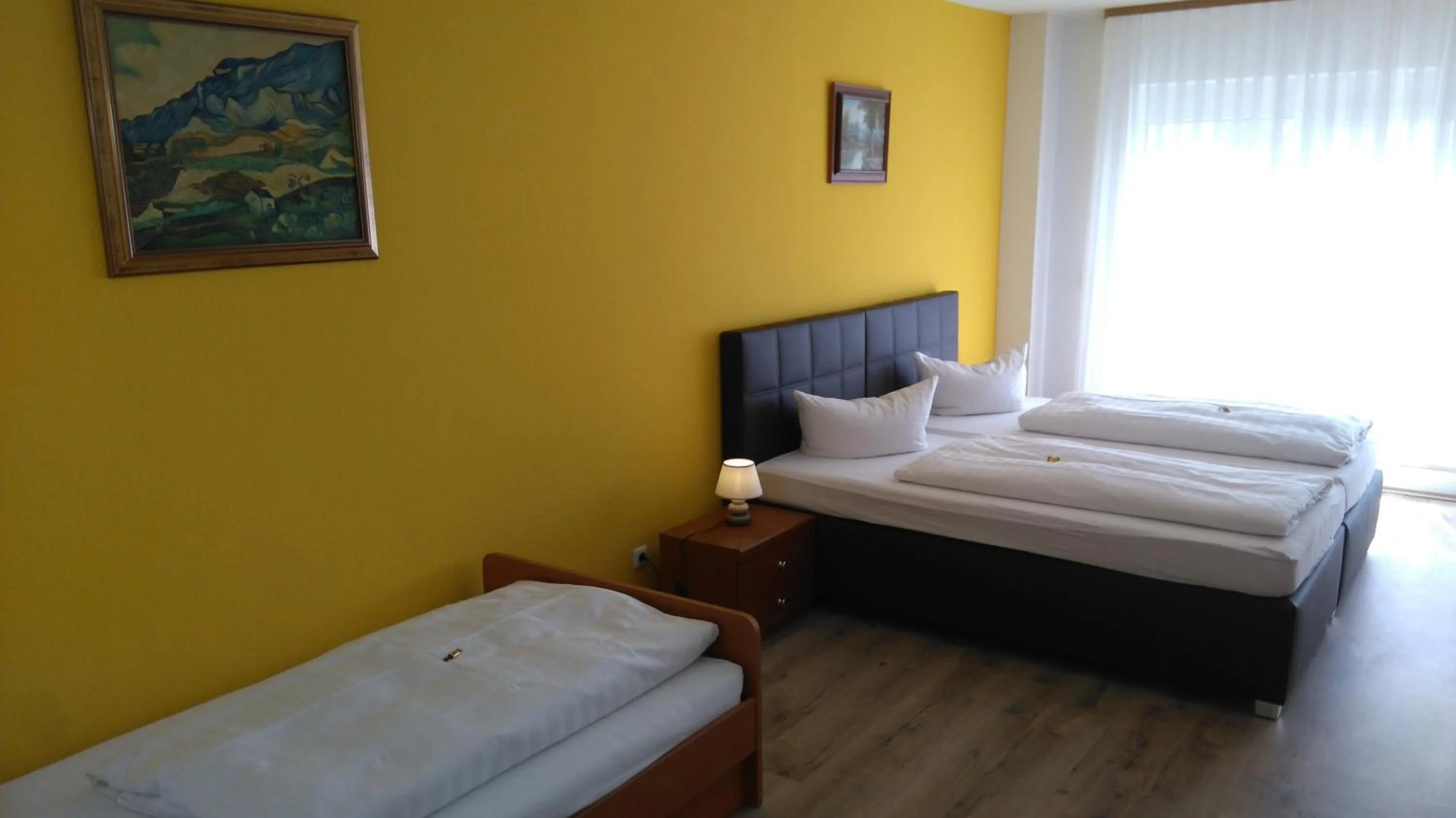 Photo of the whole room, Bed in Hotel Arheilger Hof