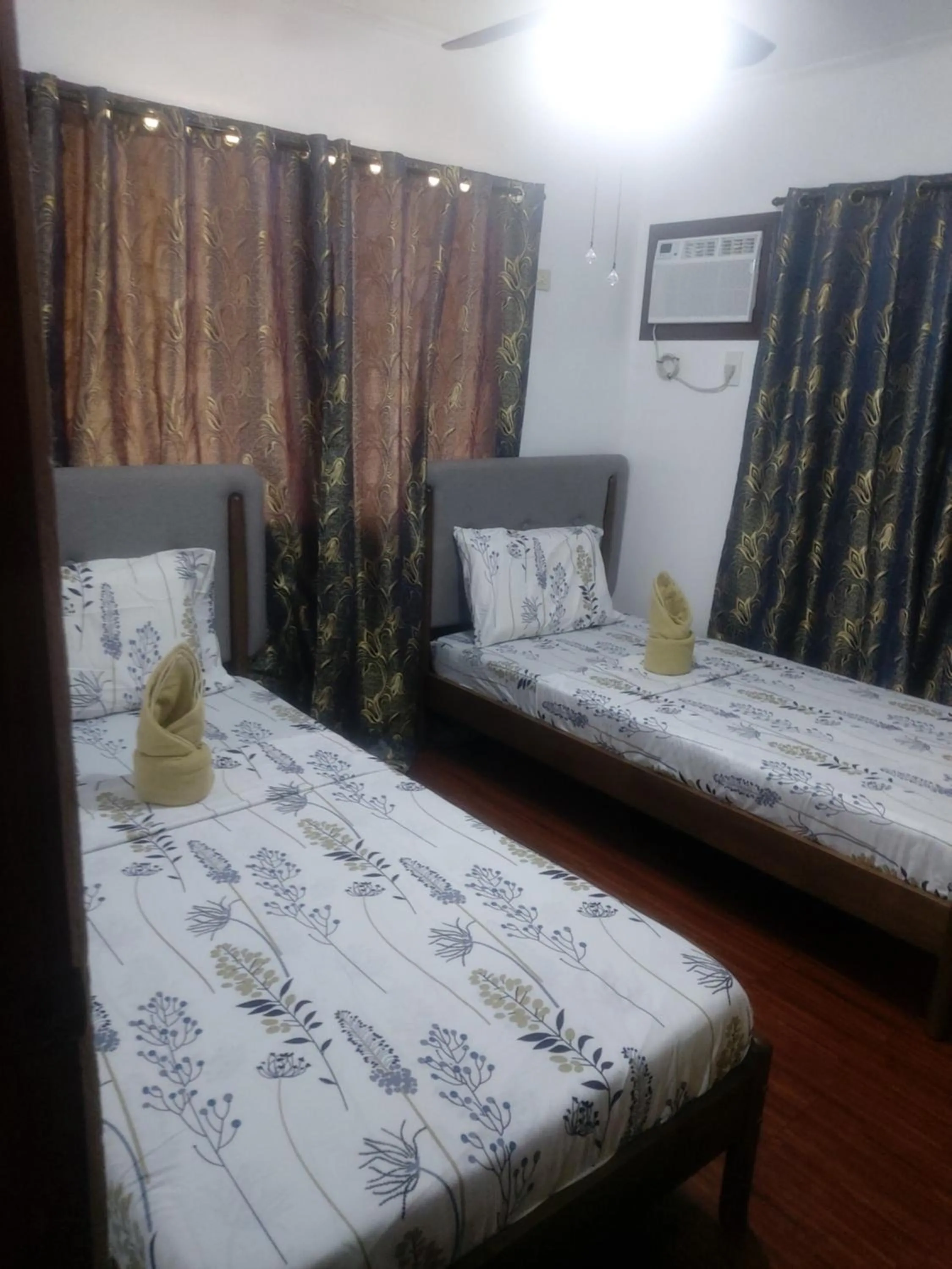 Bed in Anda Poseidon’s Beach Resort