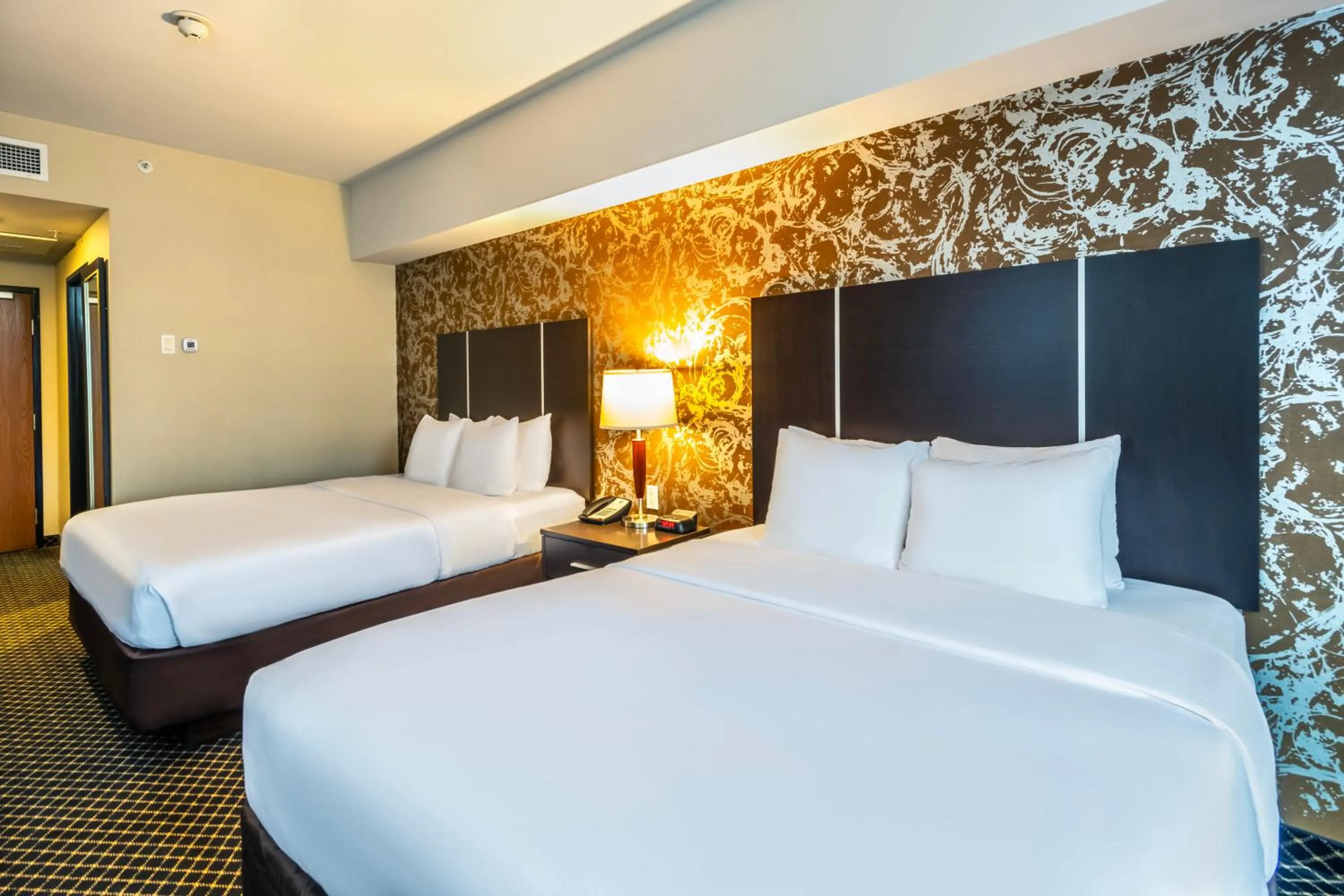 Bed in Quality Inn & Suites