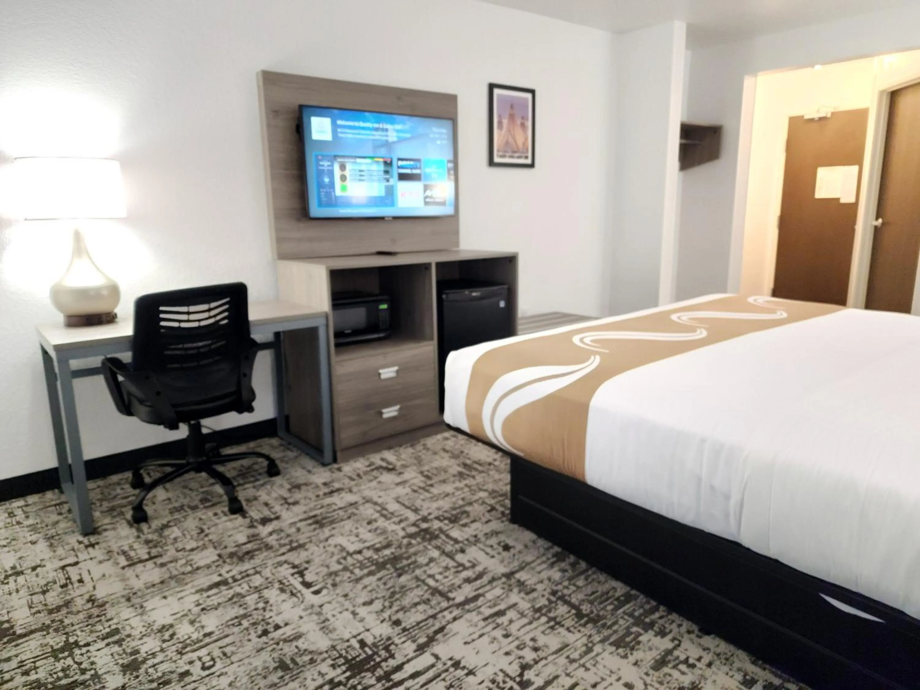Bed in Quality Inn & Suites Denver International Airport